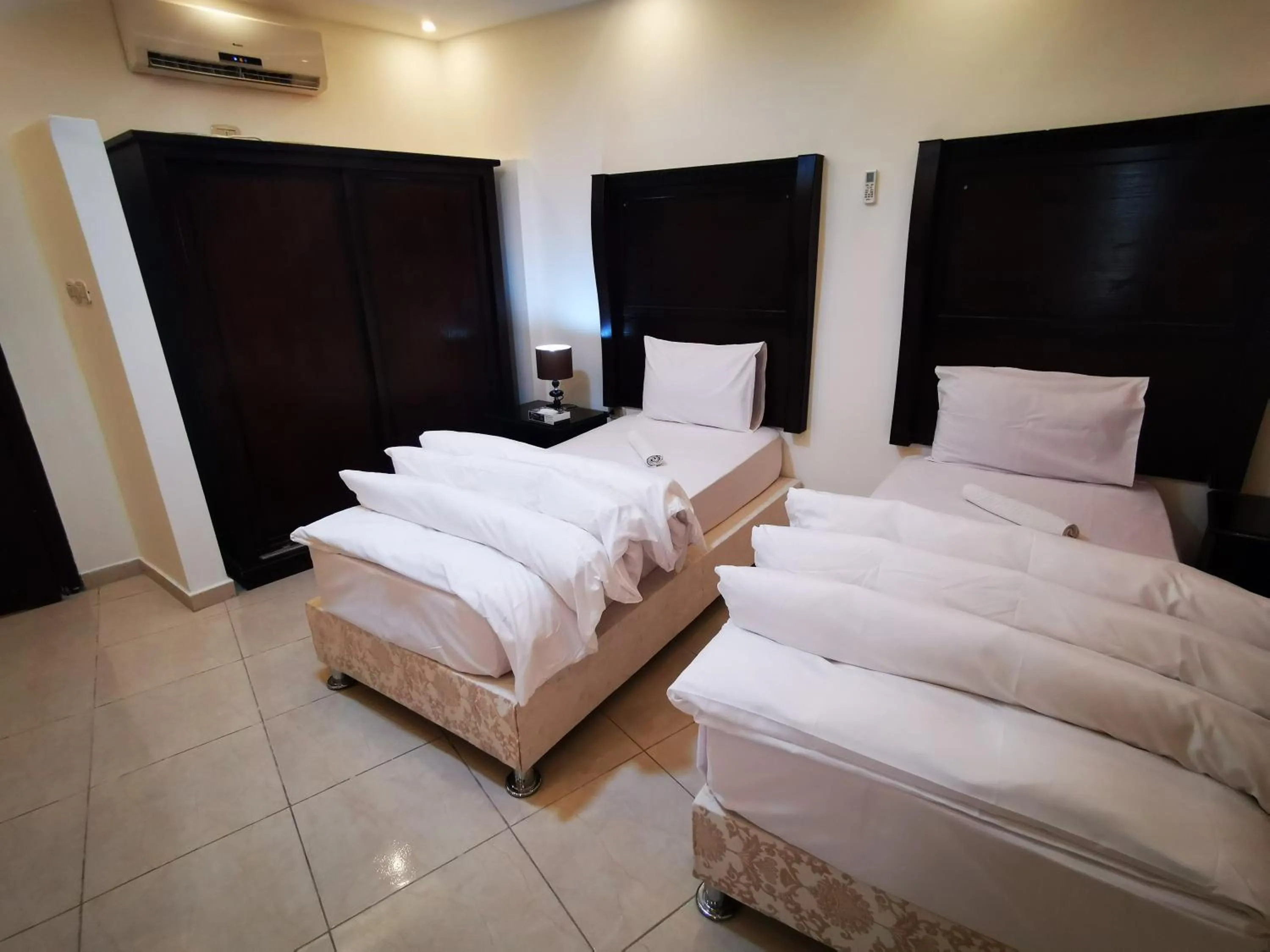 Bed in Al Fakher Hotel Apartments & Suites