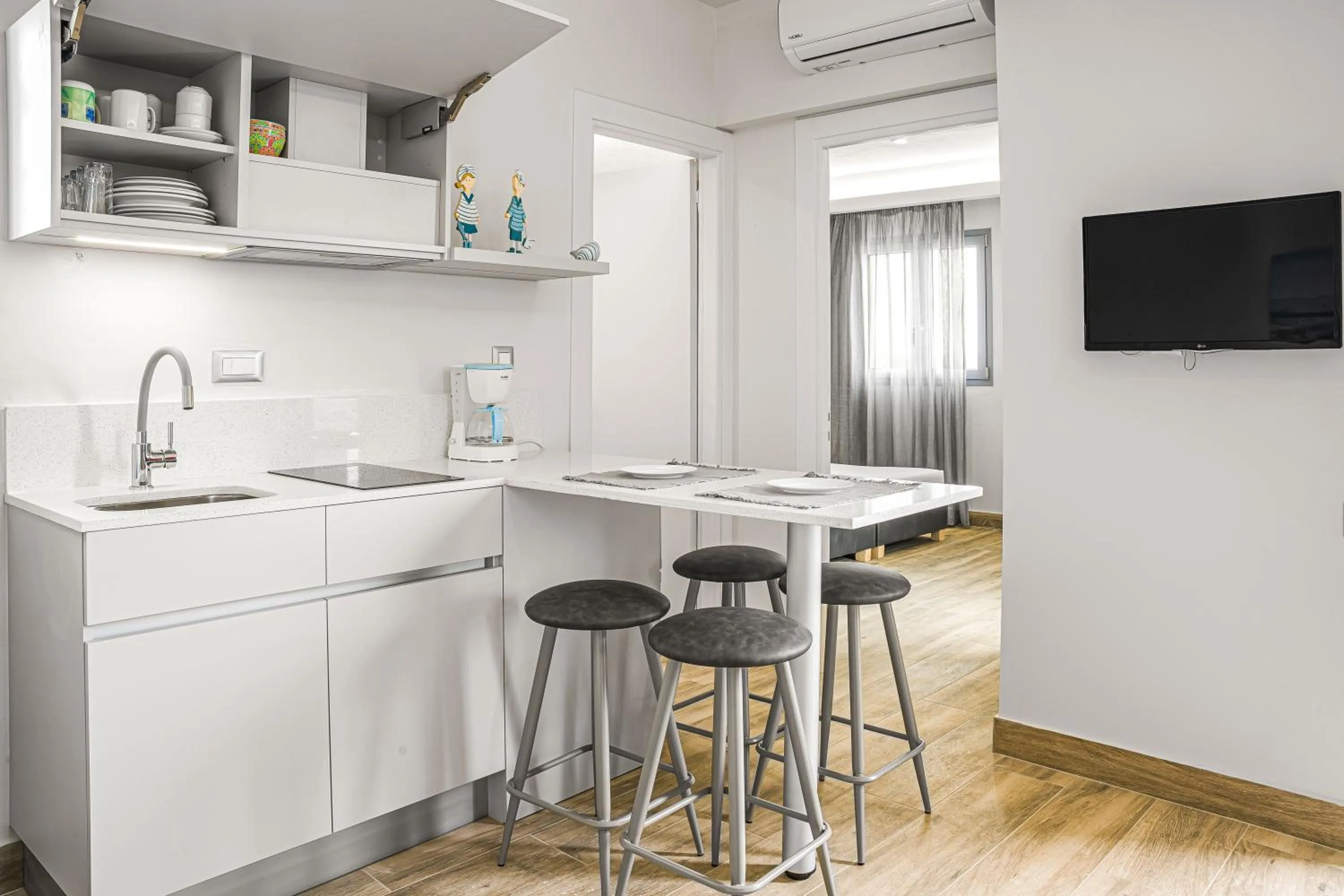 Kitchen or kitchenette in Sergiani Garden Hotel Apartments