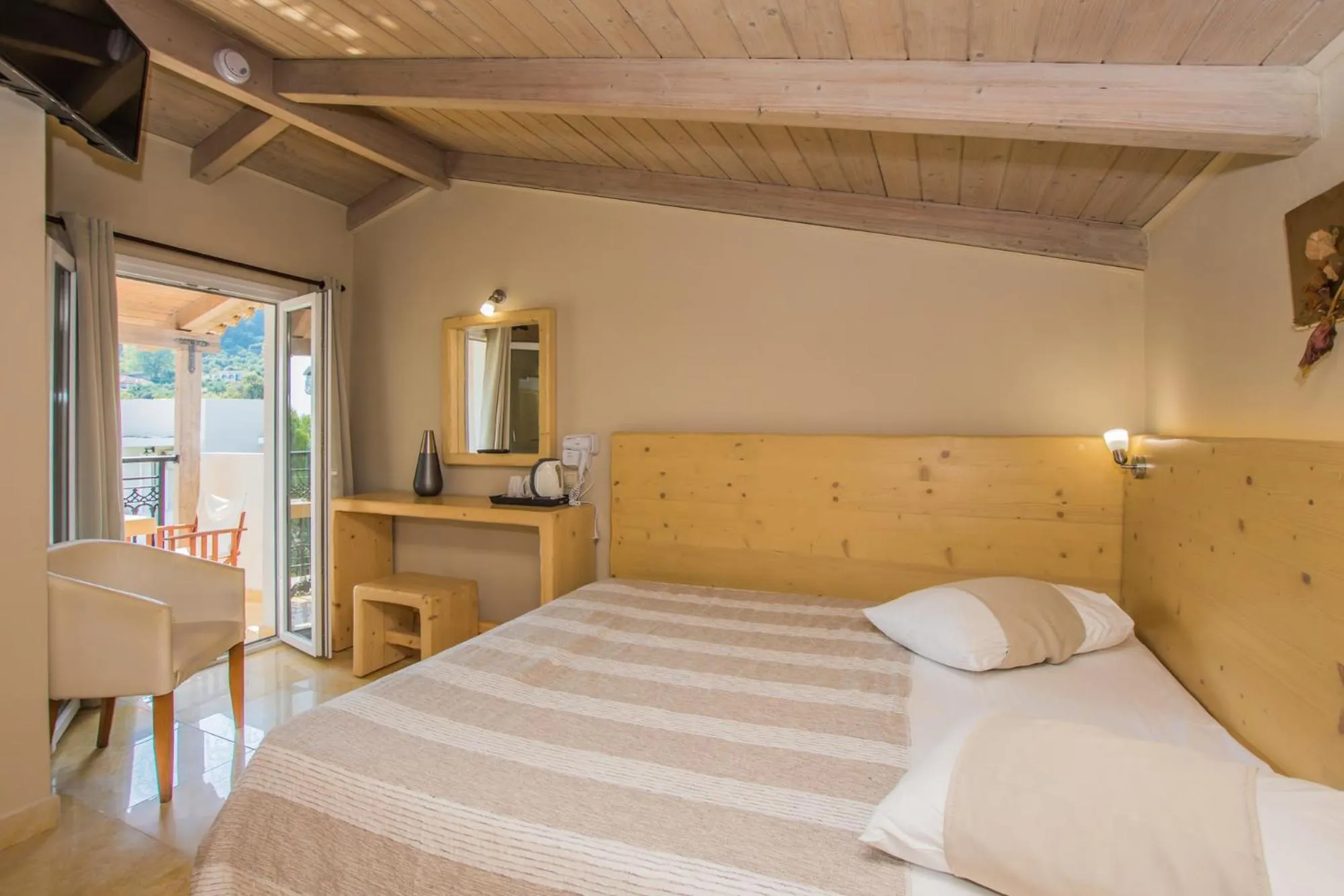 Photo of the whole room, Bed in Iniohos Zante Hotel & Suites