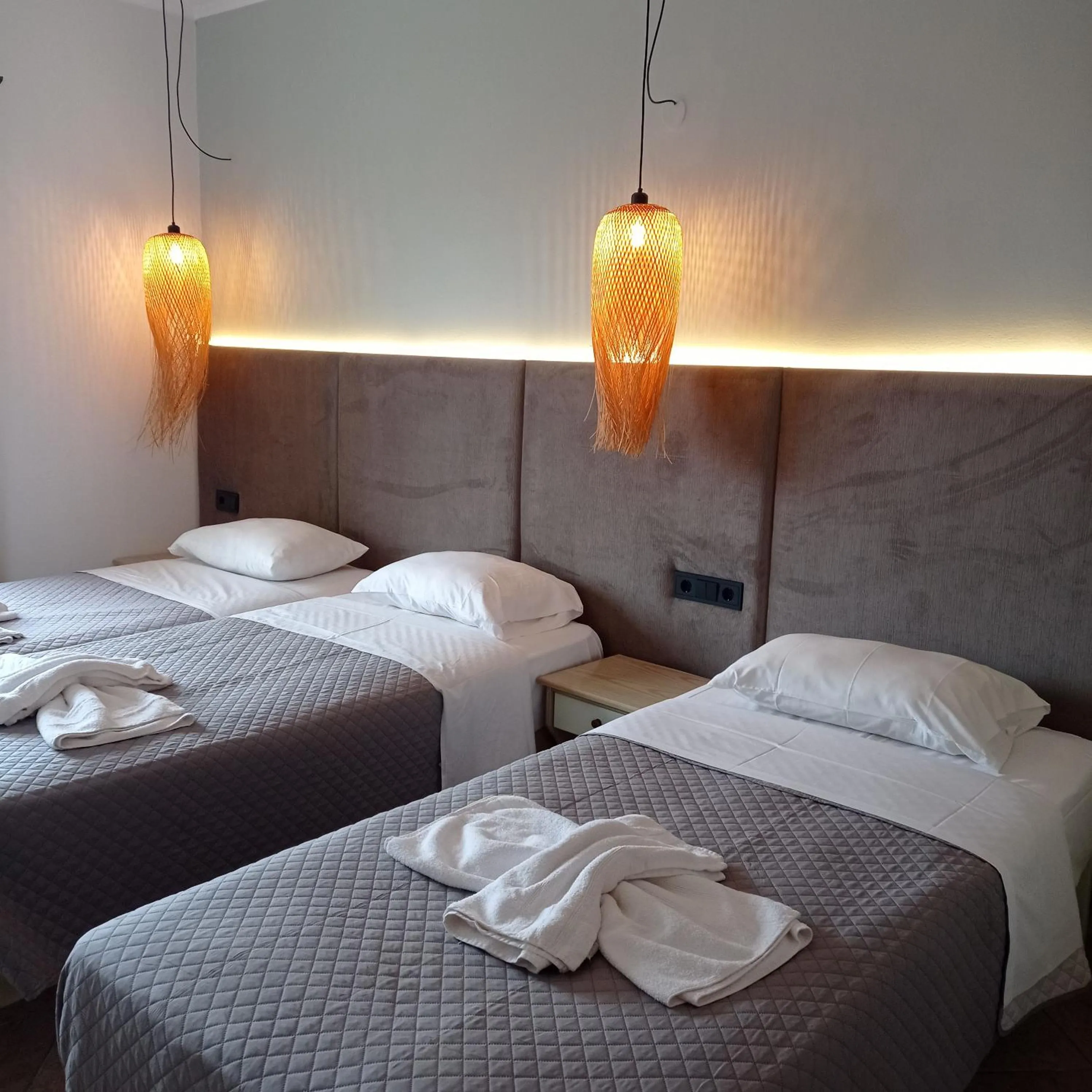 Bed in Ninos On The Beach Hotel