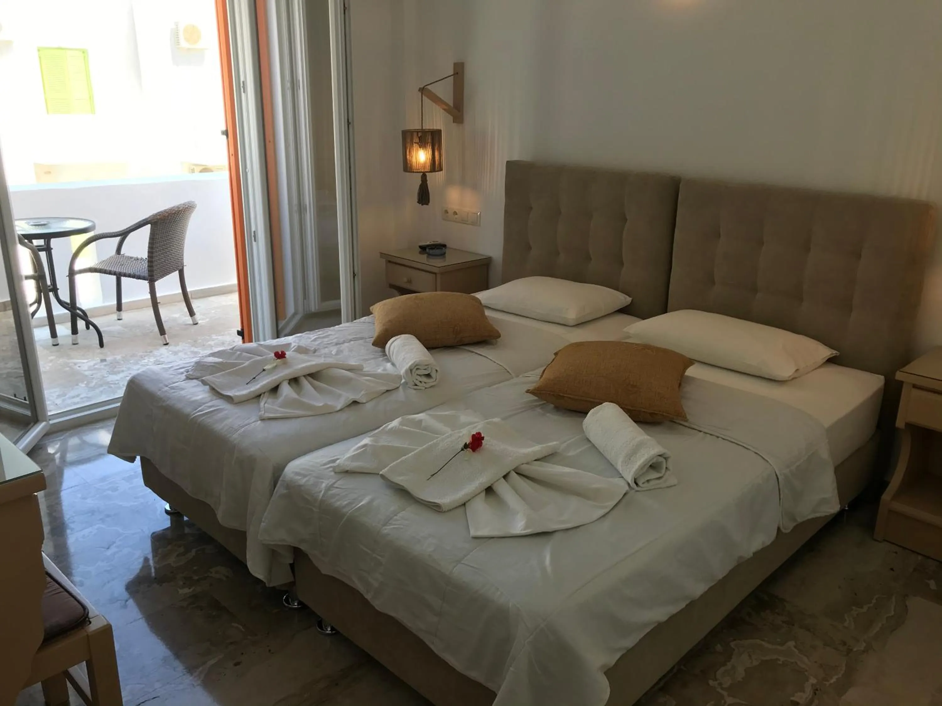 Bed in Vassiliki Rooms