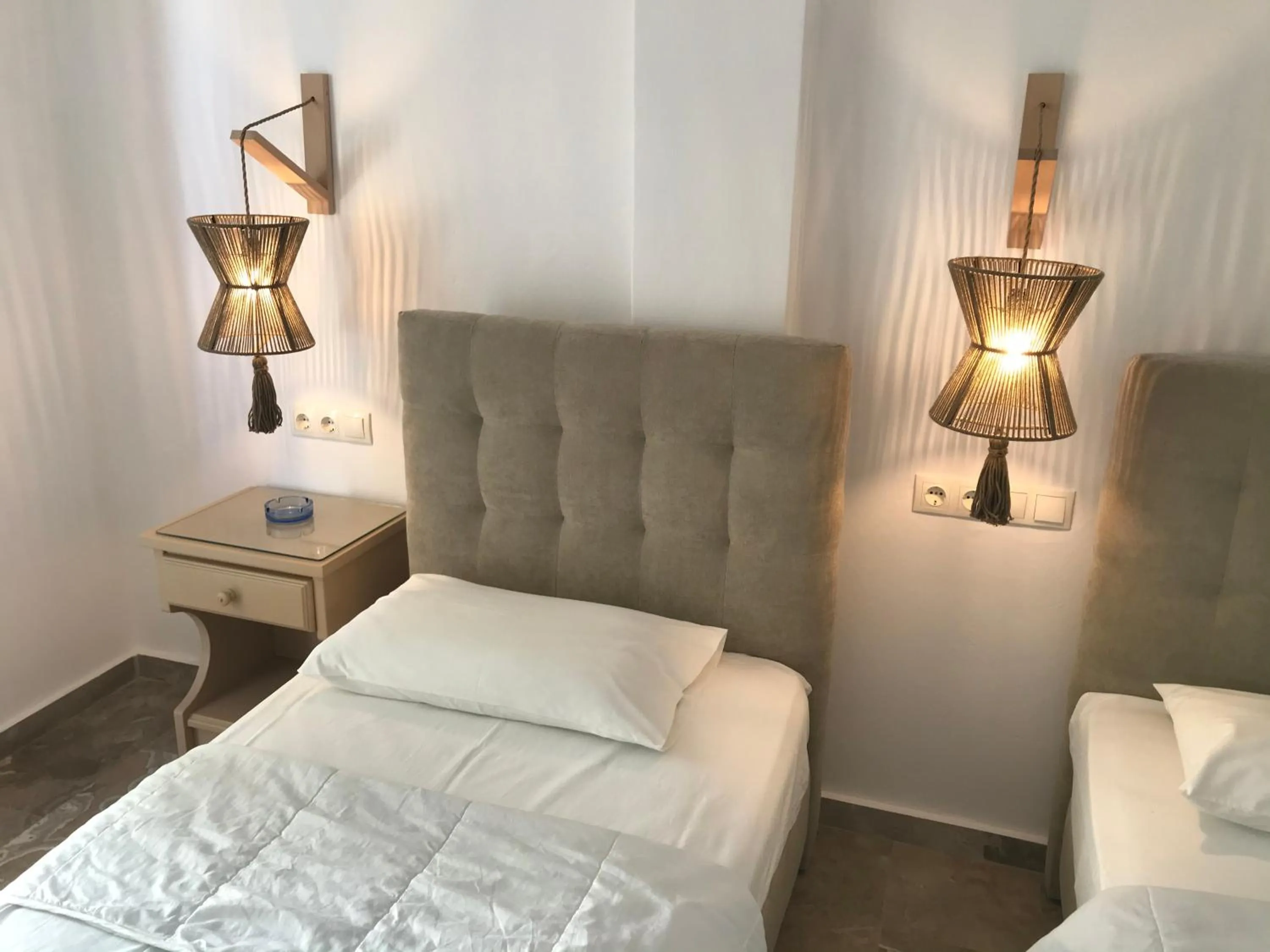 Bed in Vassiliki Rooms