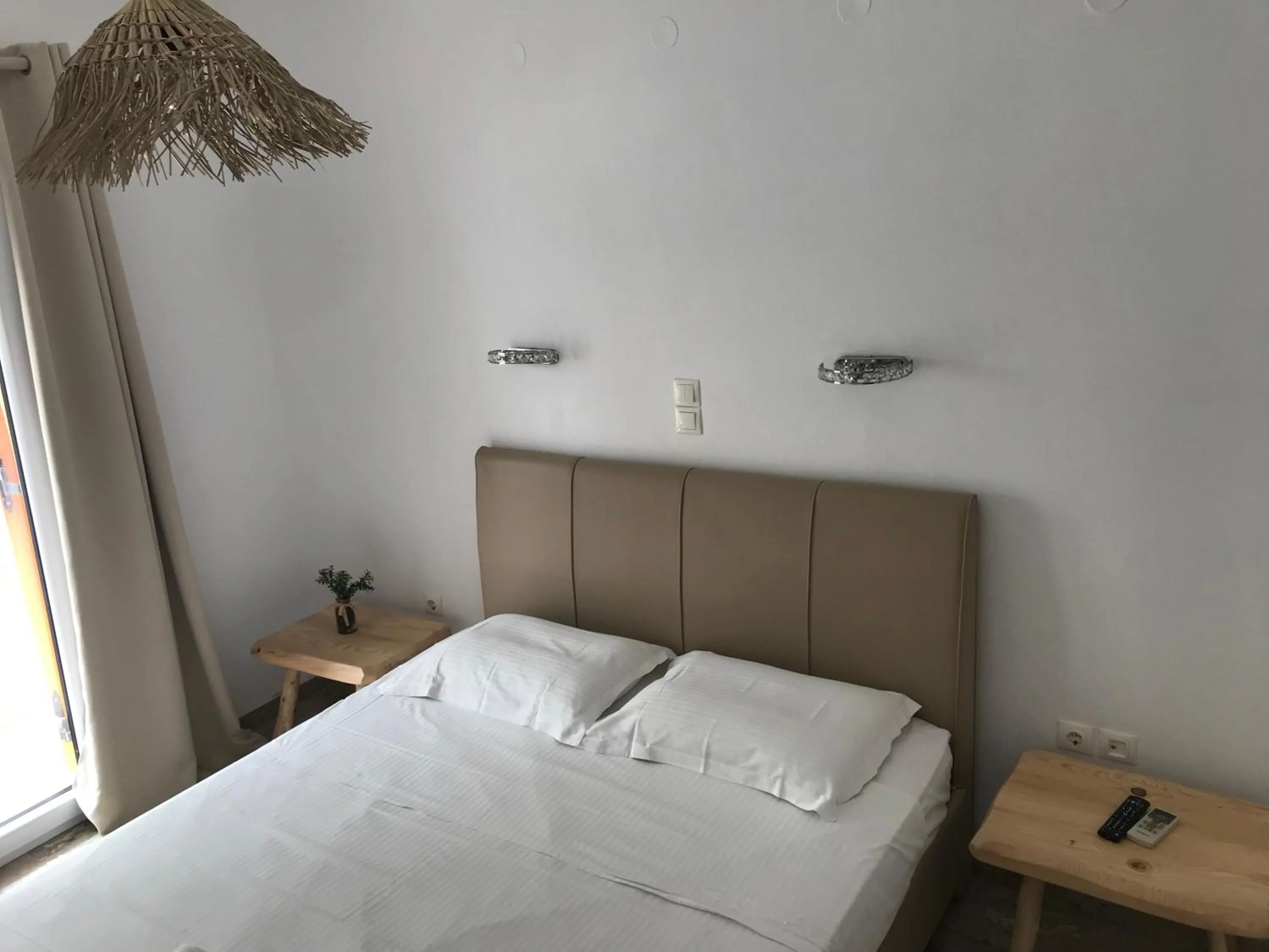 Bed in Vassiliki Rooms