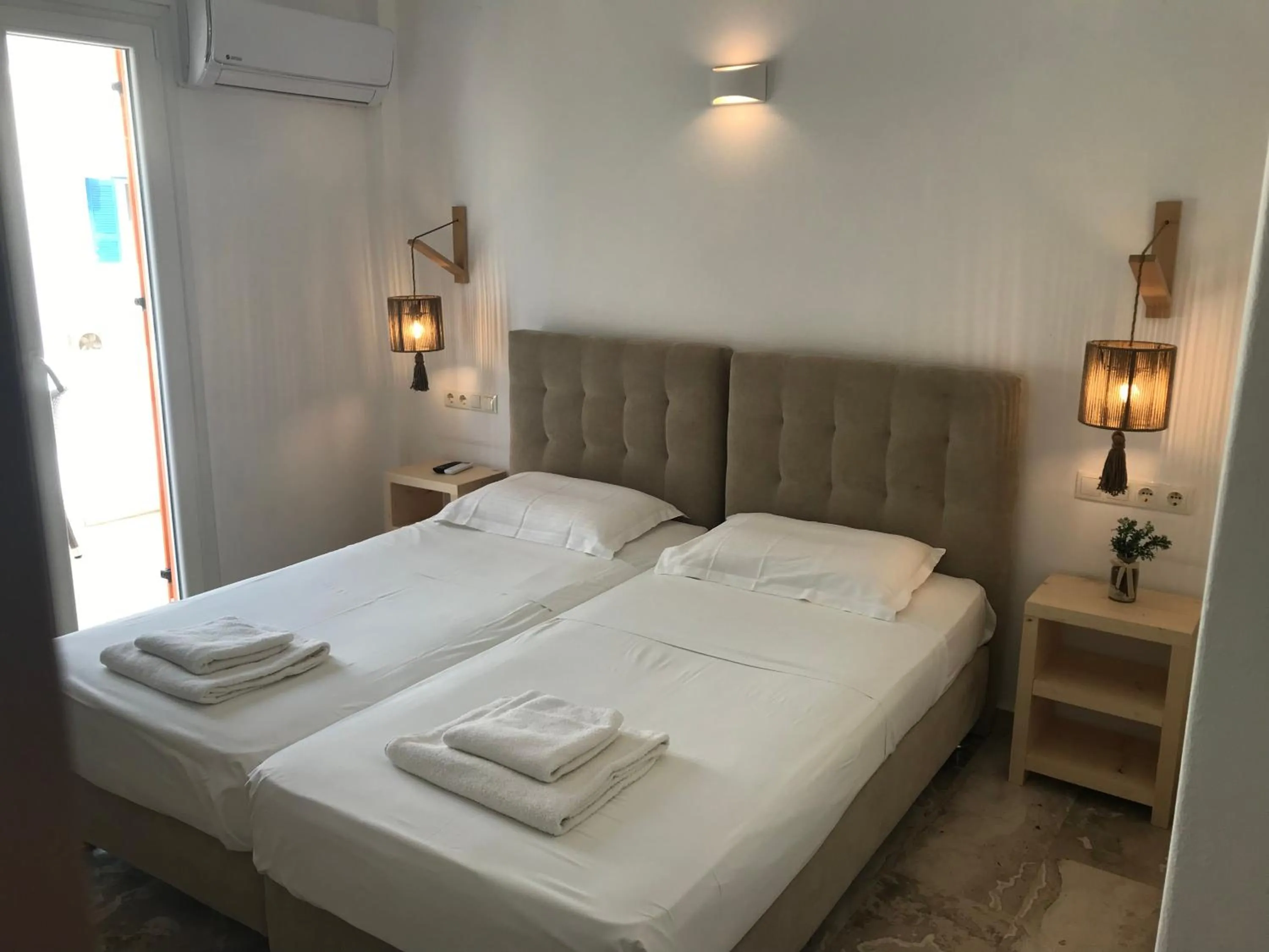 Bed in Vassiliki Rooms