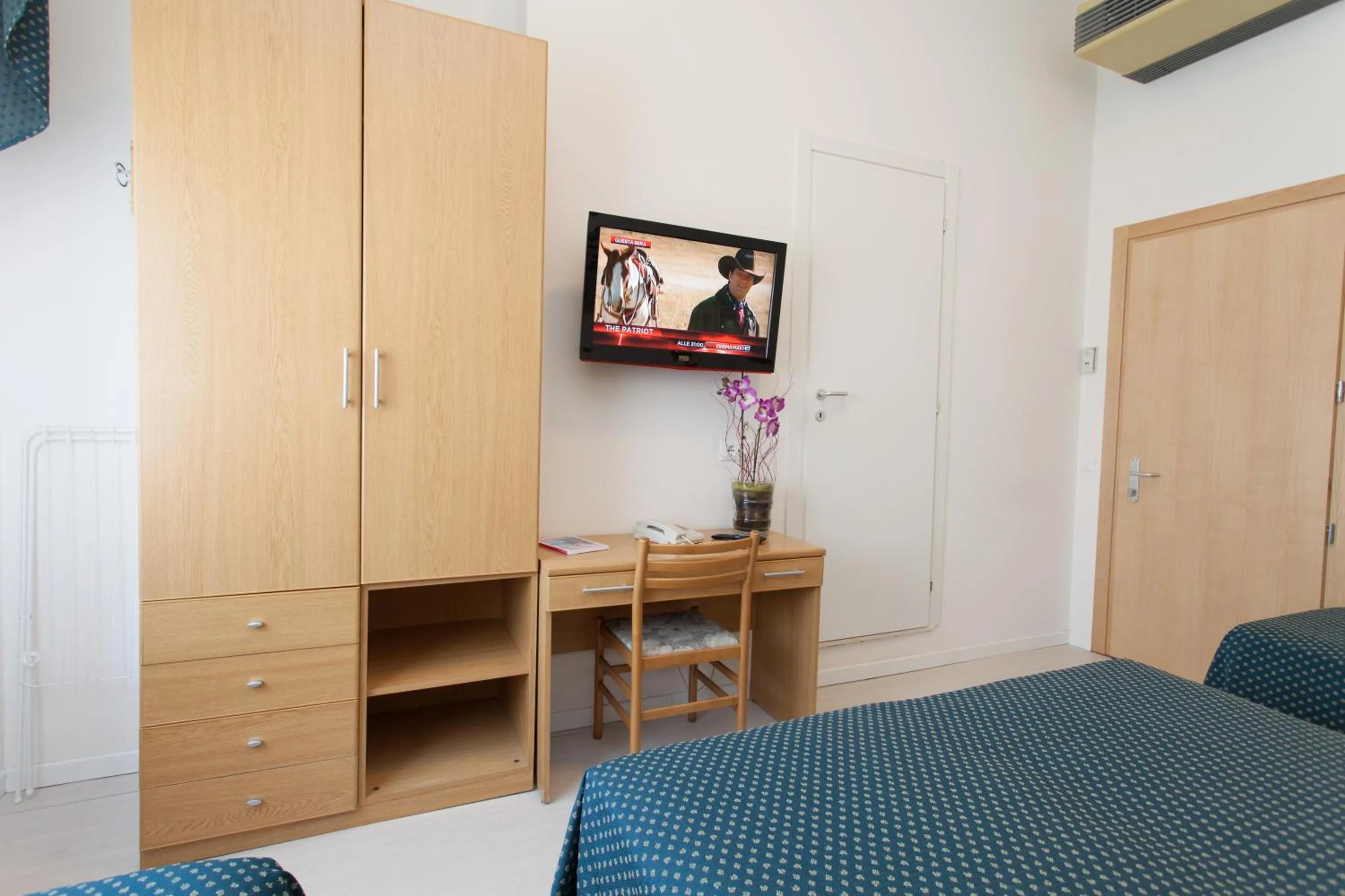 Seating area, Bed in Hotel Marina