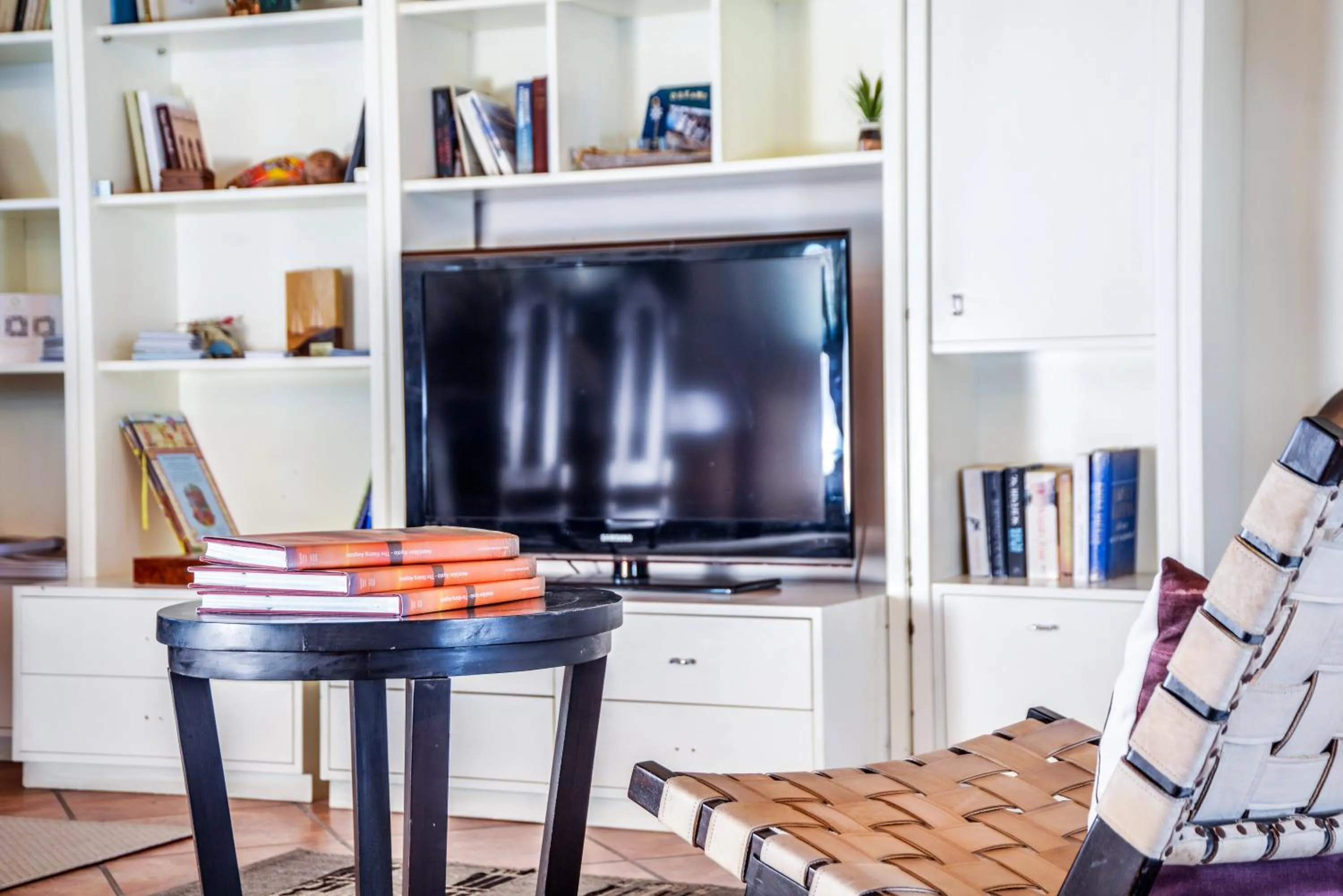 Communal lounge/ TV room in Varos Village Boutique Hotel