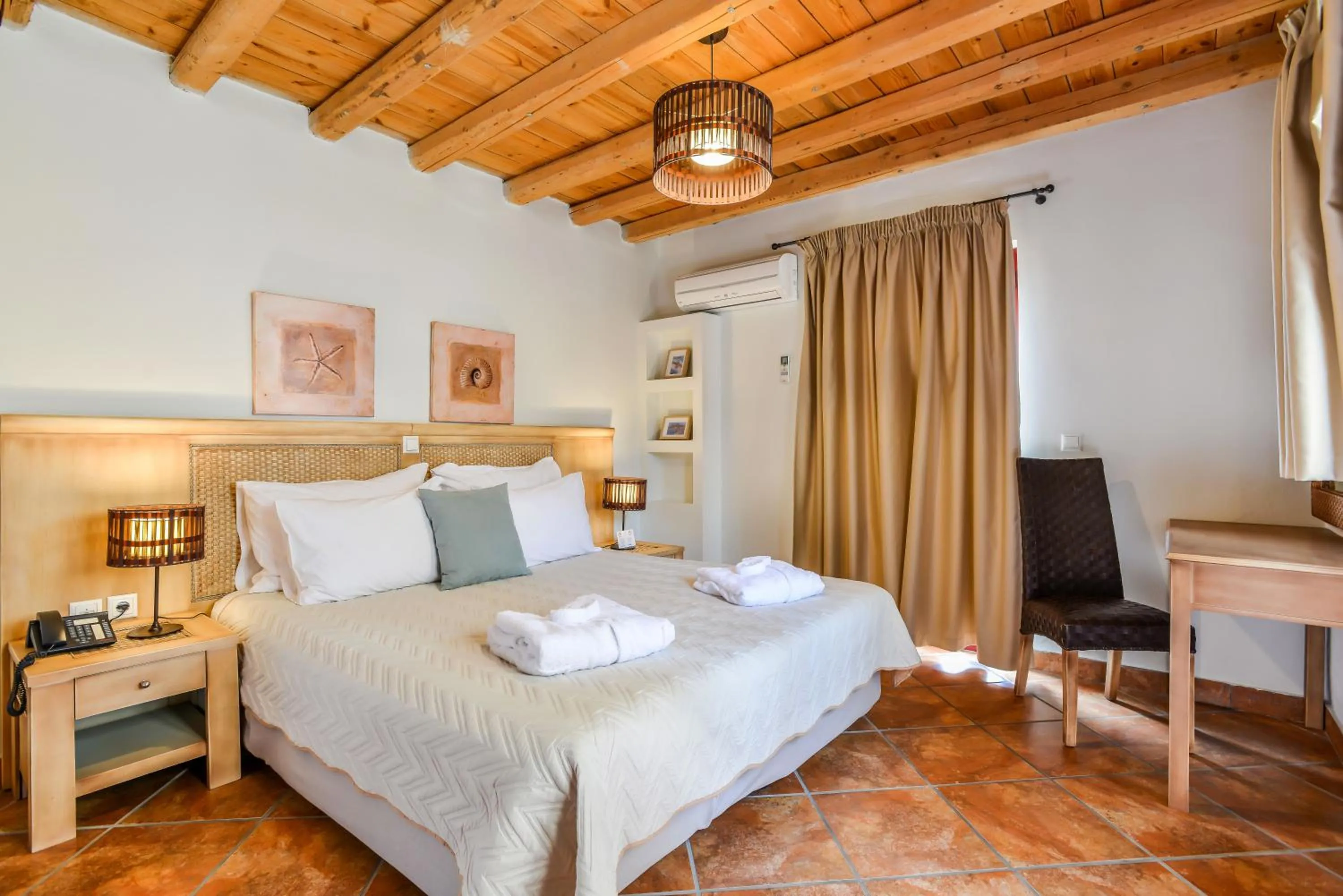 Bed in Varos Village Boutique Hotel