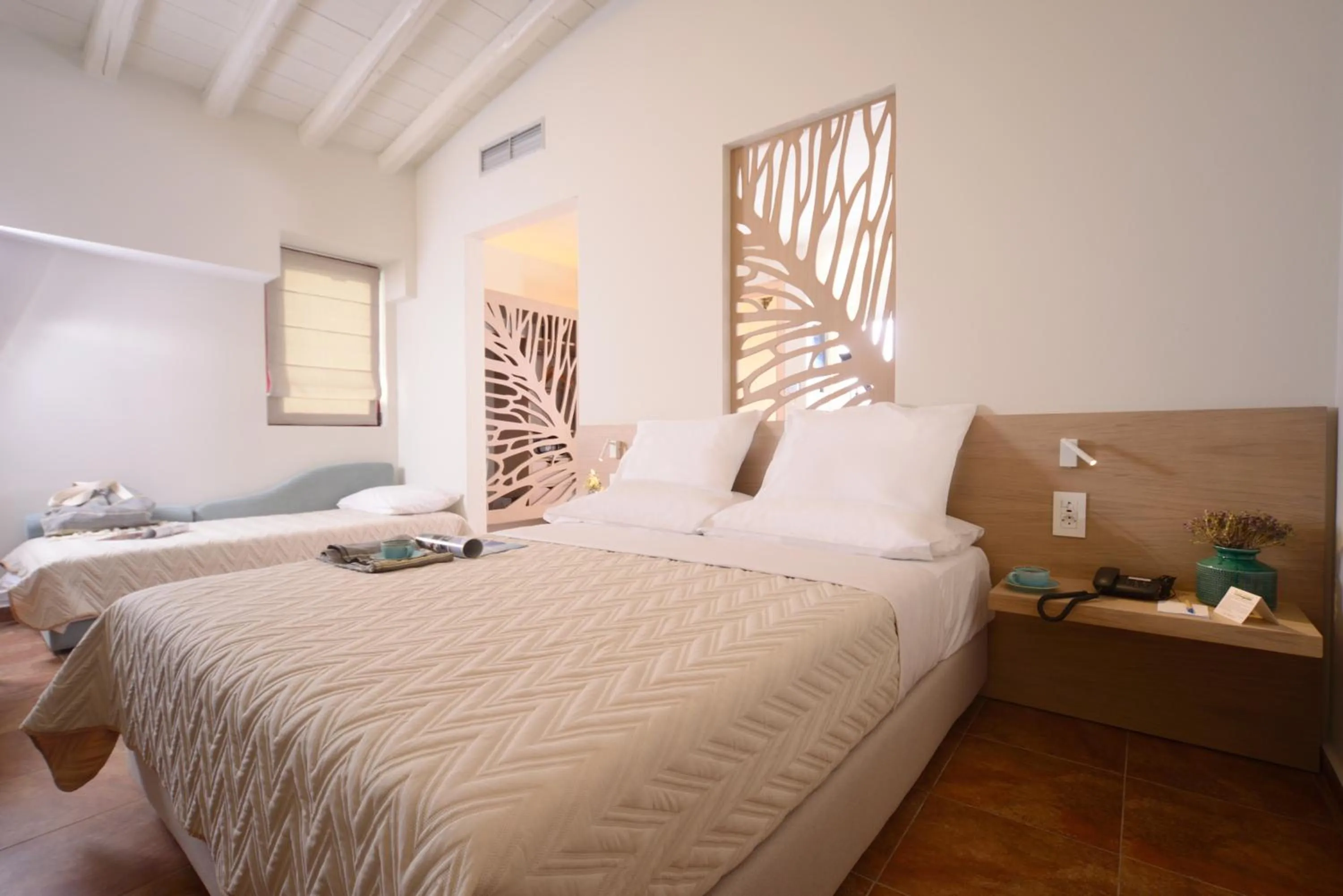 Bed in Varos Village Boutique Hotel