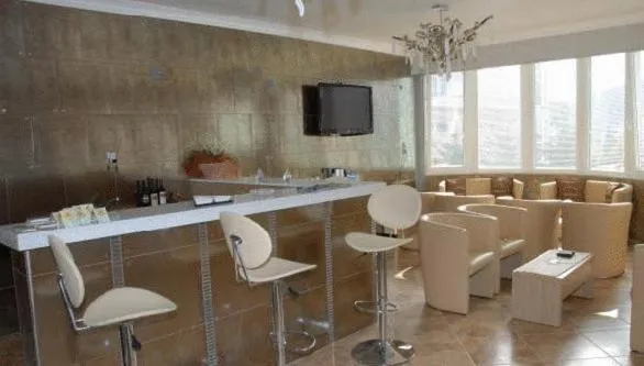 Communal lounge/ TV room in Kyknos De Luxe Suites & Rooms