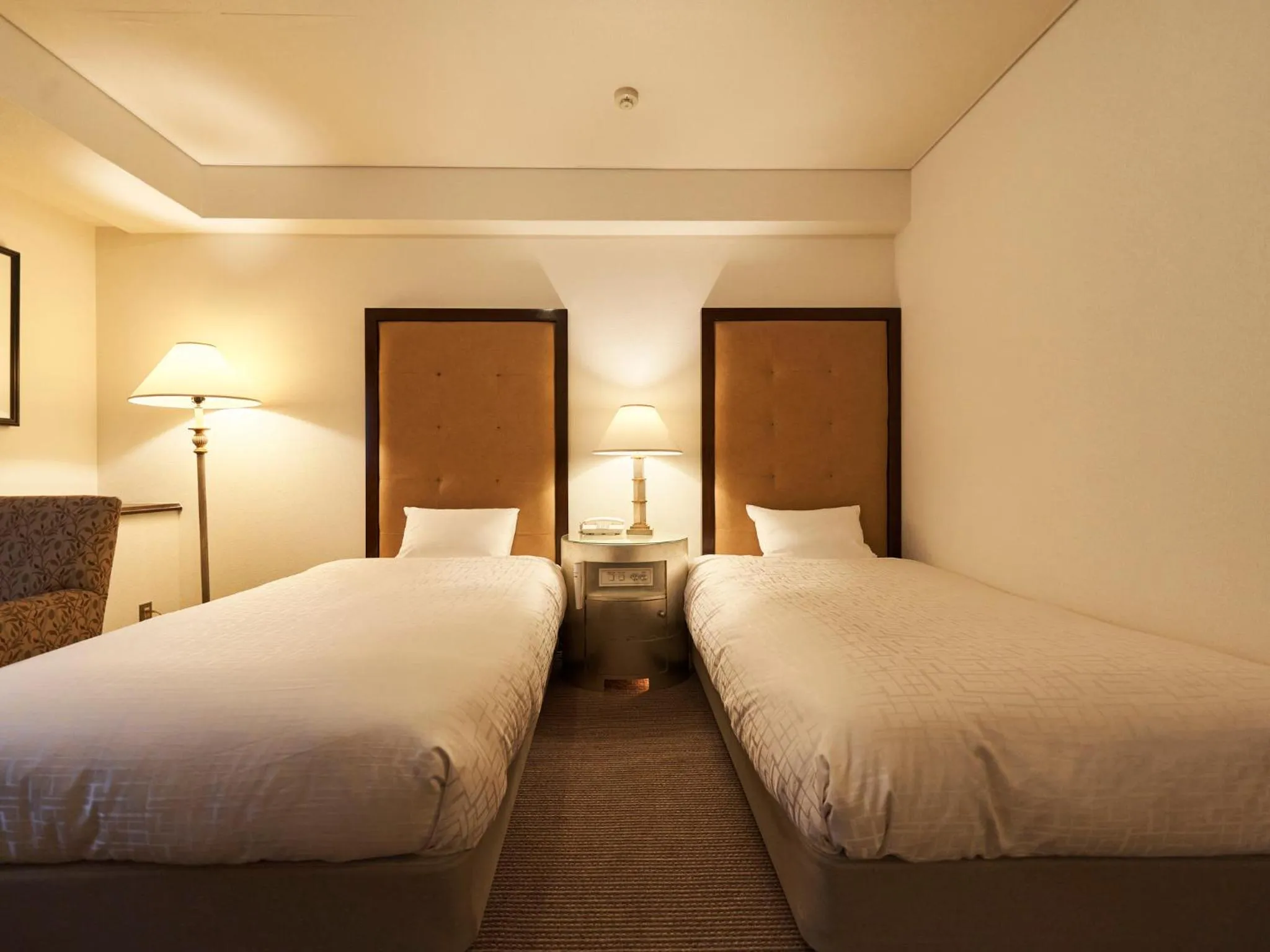 Bed in Princess Garden Hotel