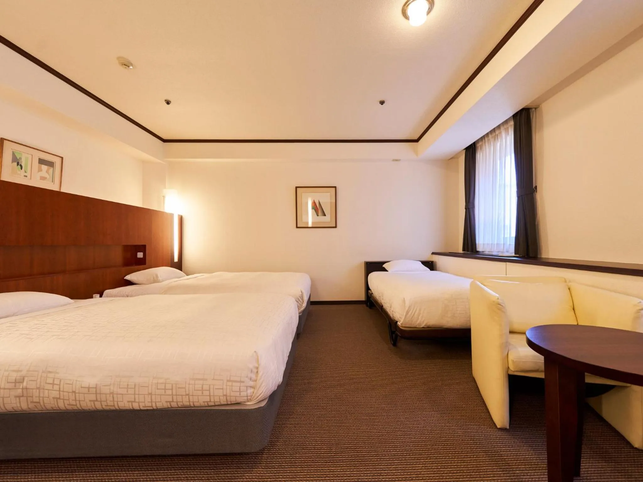 Bed in Princess Garden Hotel