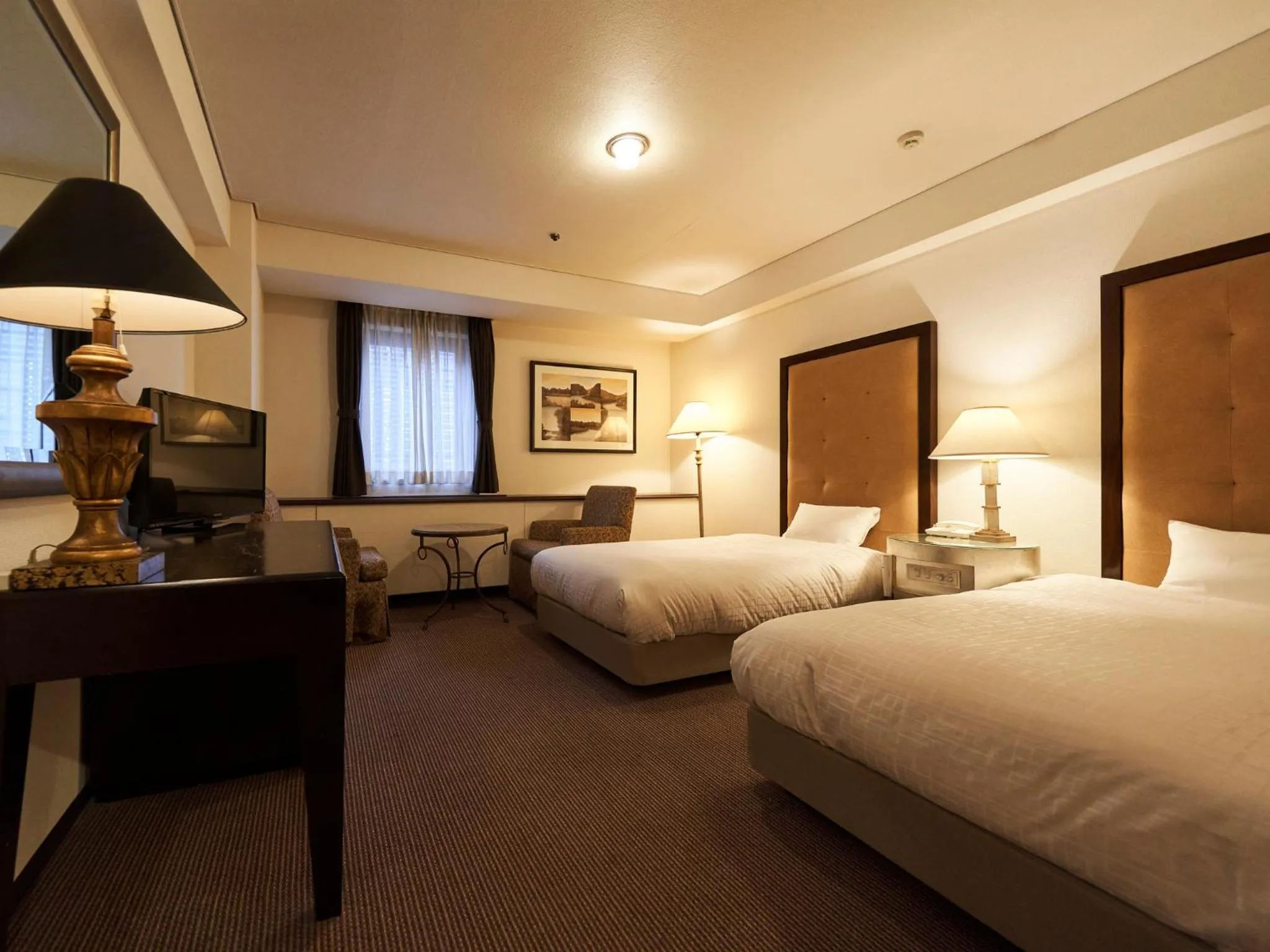 Bed in Princess Garden Hotel