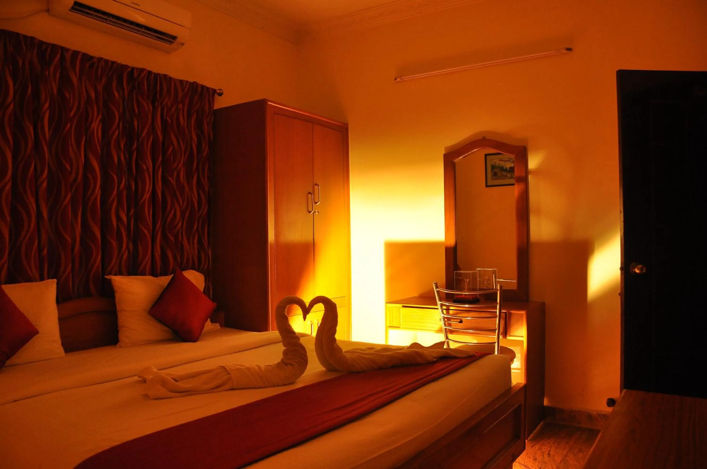 Bed in Green Grande Inn