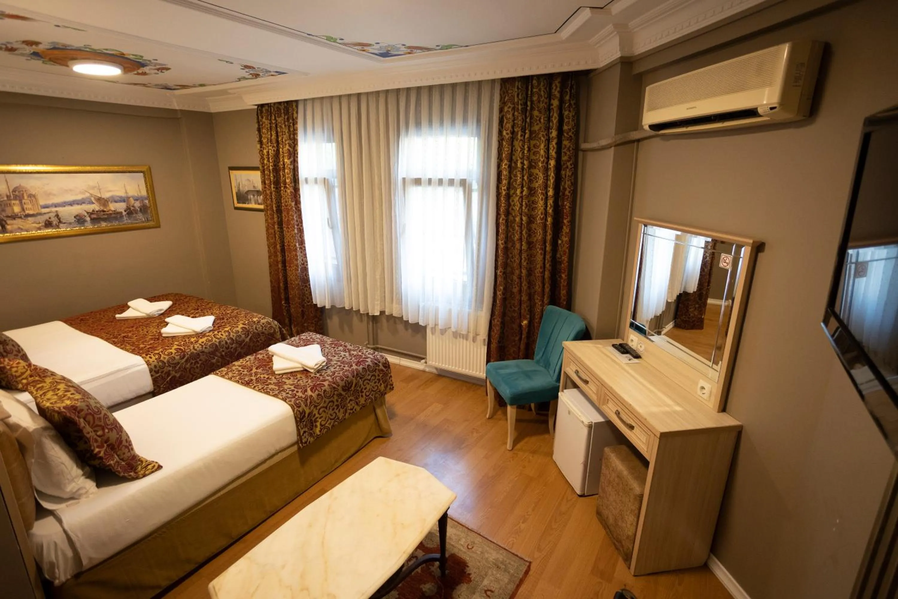 Bed in Tashkonak Studio Suites