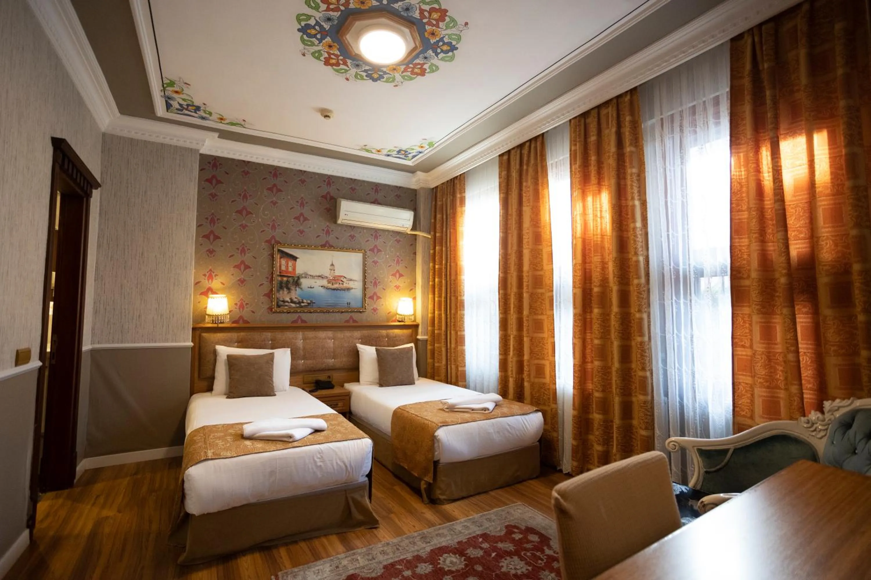 Bed in Tashkonak Studio Suites