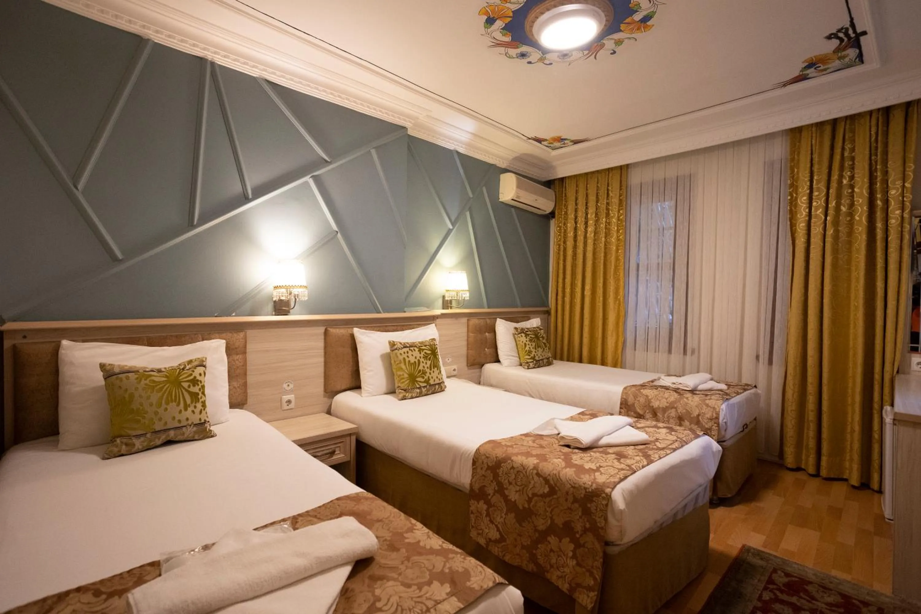 Bed in Tashkonak Studio Suites