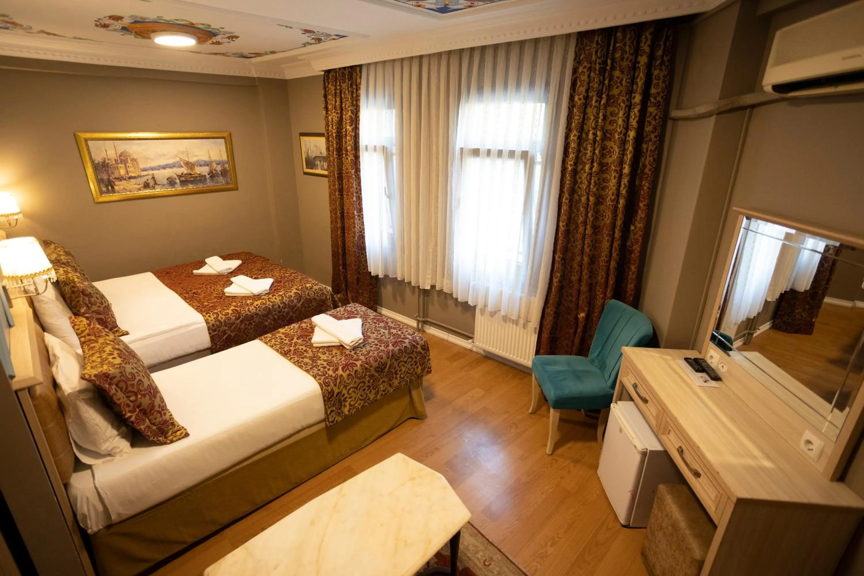 Bed in Tashkonak Studio Suites