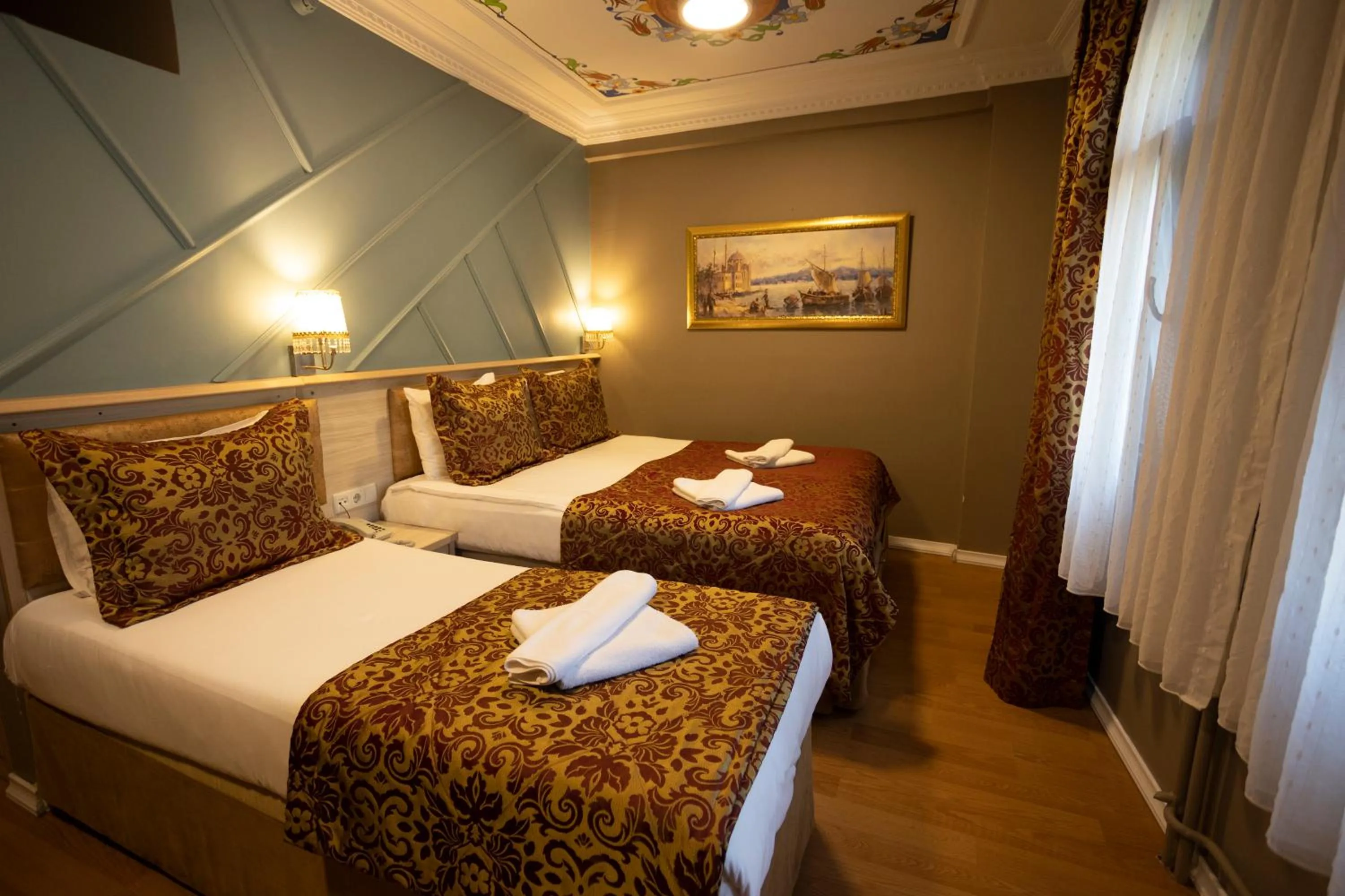 Bed in Tashkonak Studio Suites