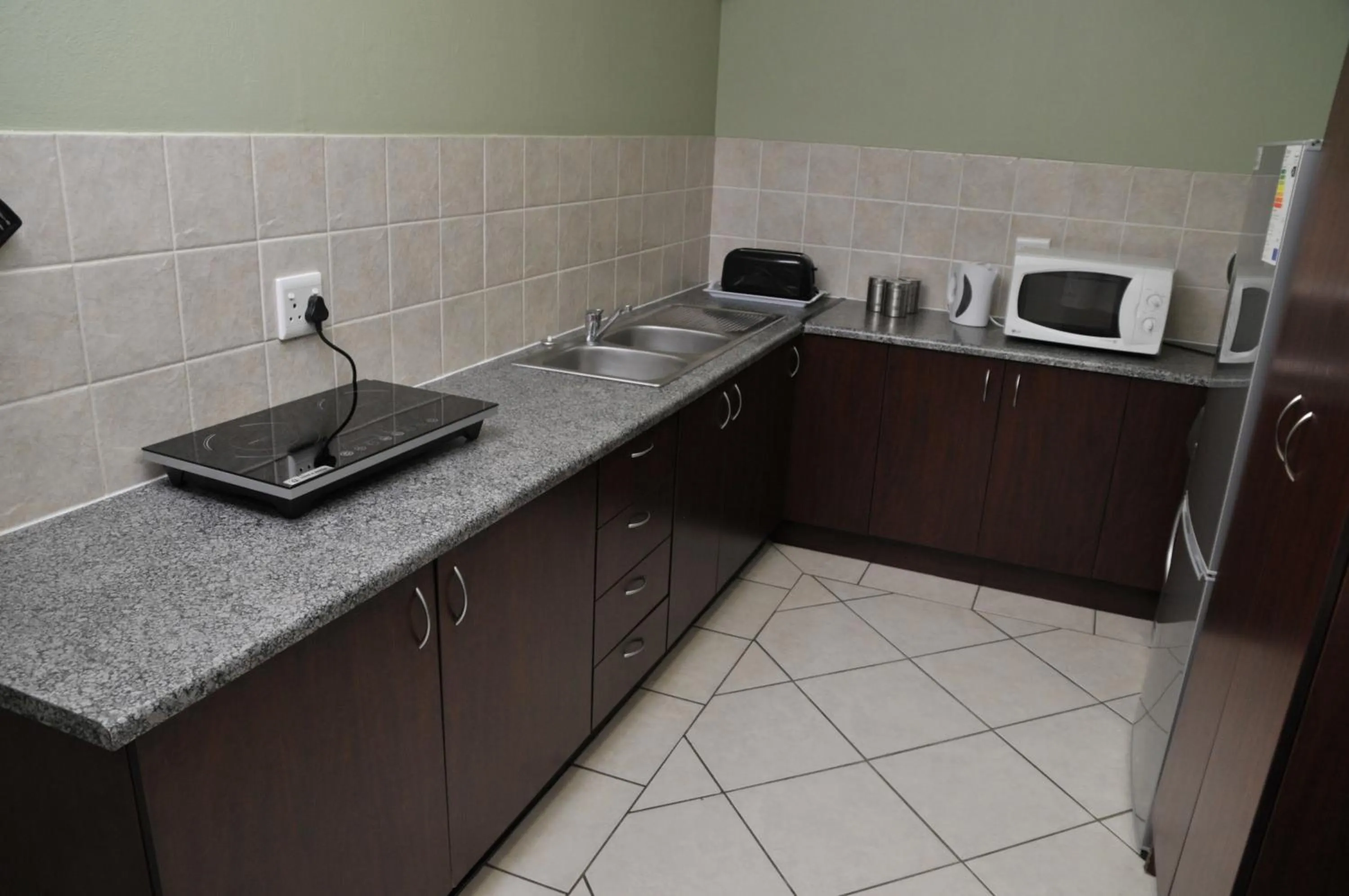 Kitchen or kitchenette in The Flower Box Long Term Accommodation