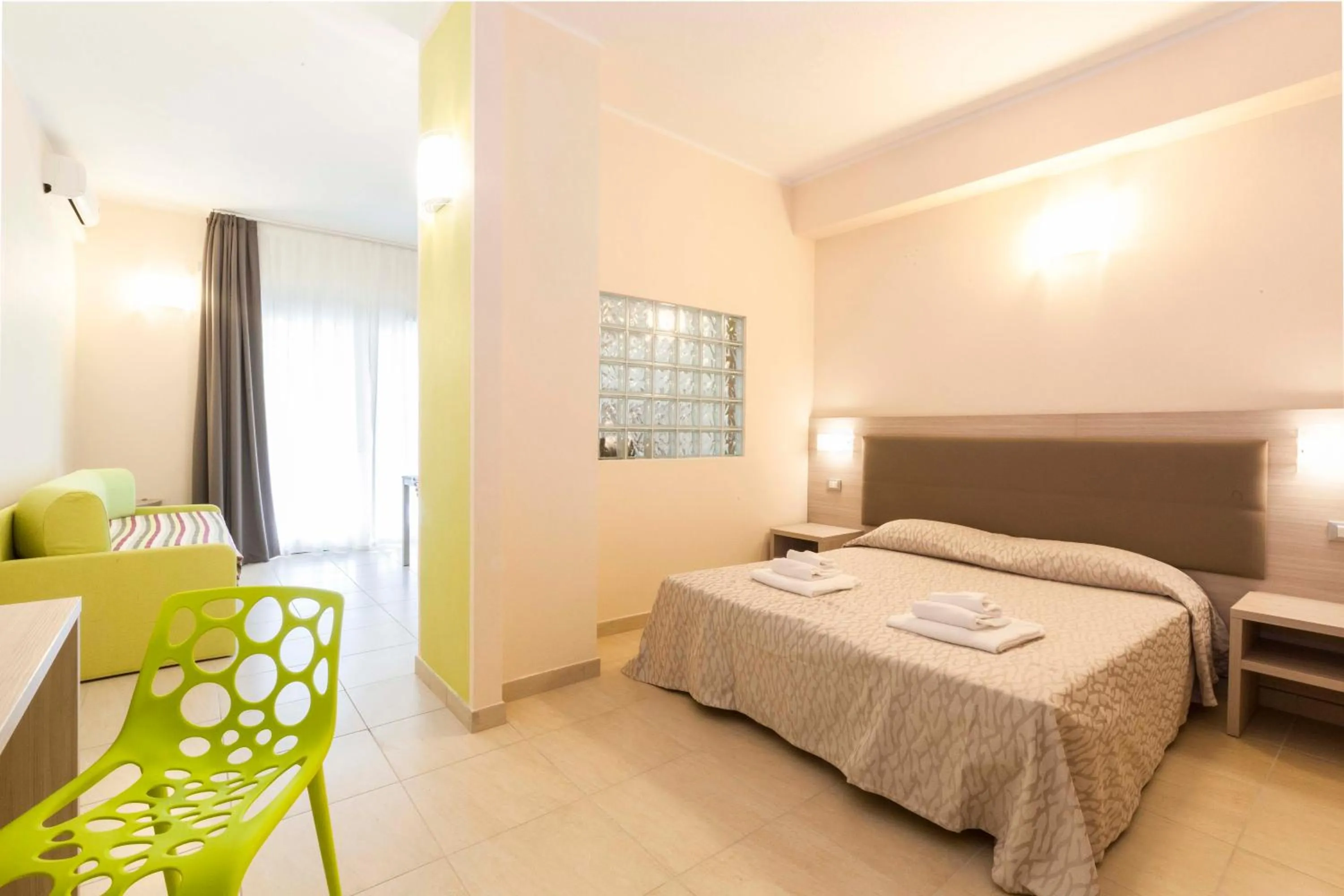 Bed in Diano Sporting Apartments
