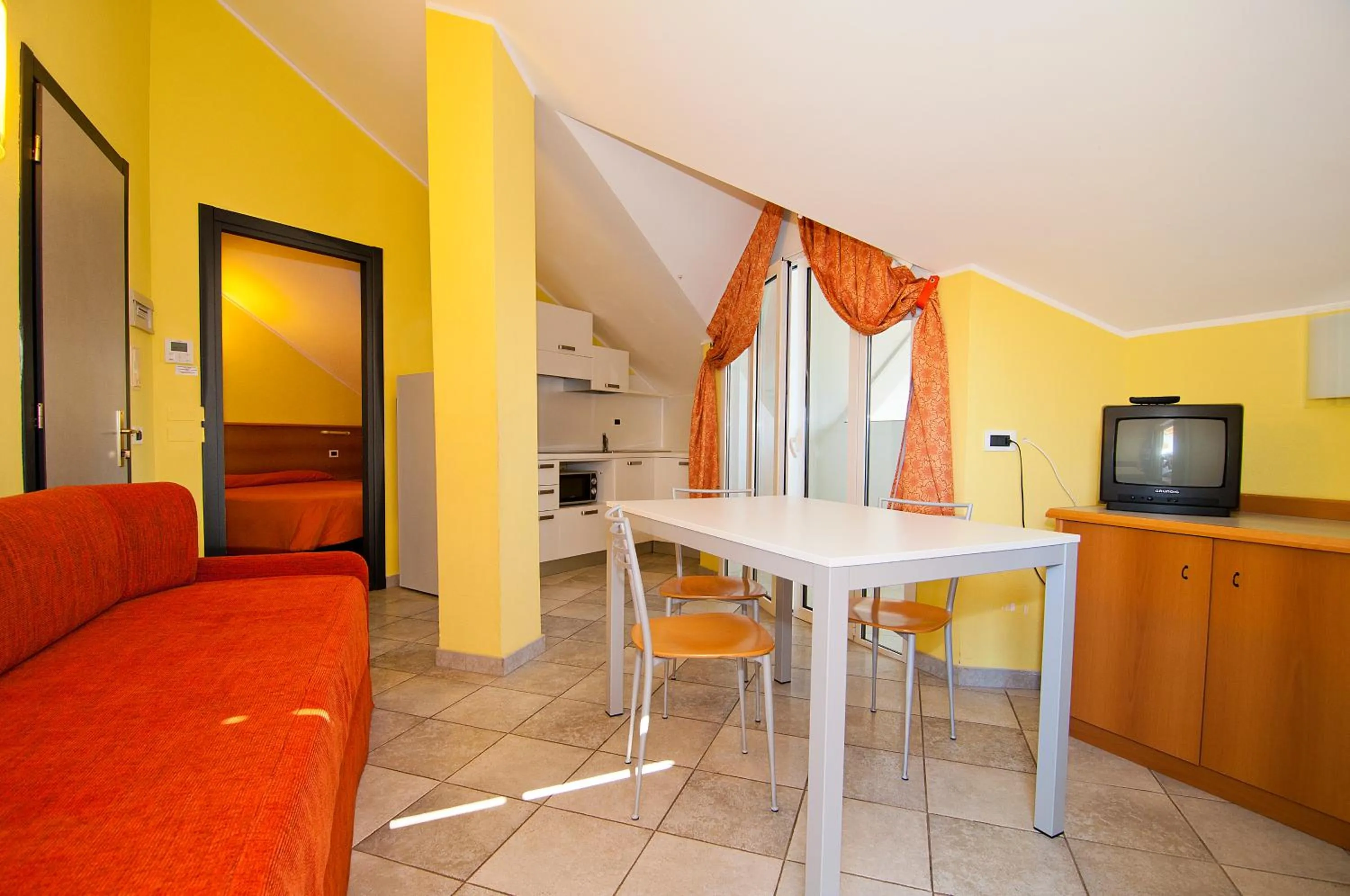 Seating area in Diano Sporting Apartments