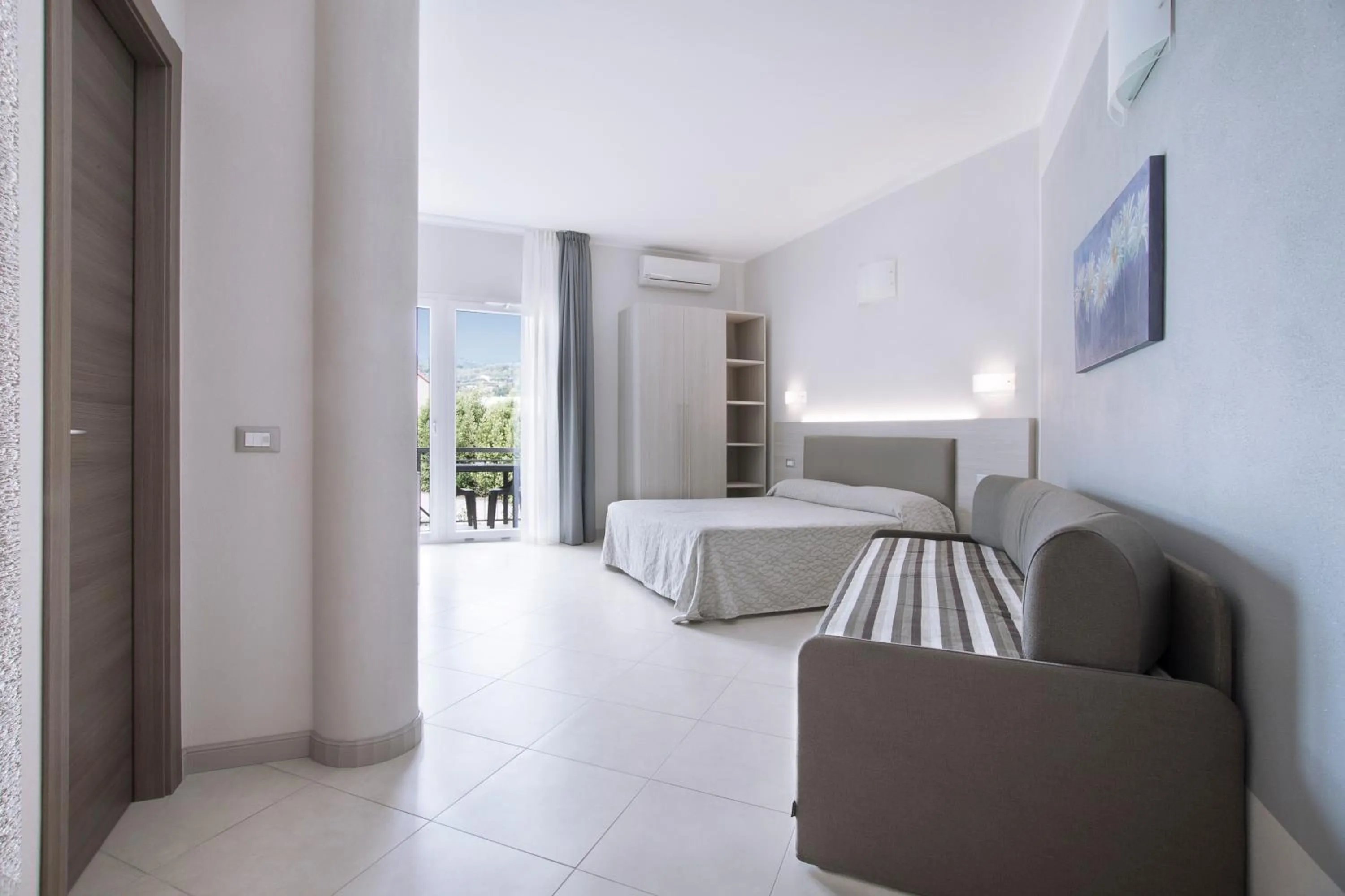 Living room, Bed in Diano Sporting Apartments
