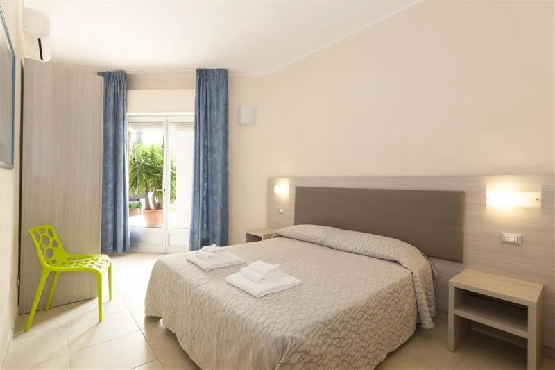 Bed in Diano Sporting Apartments
