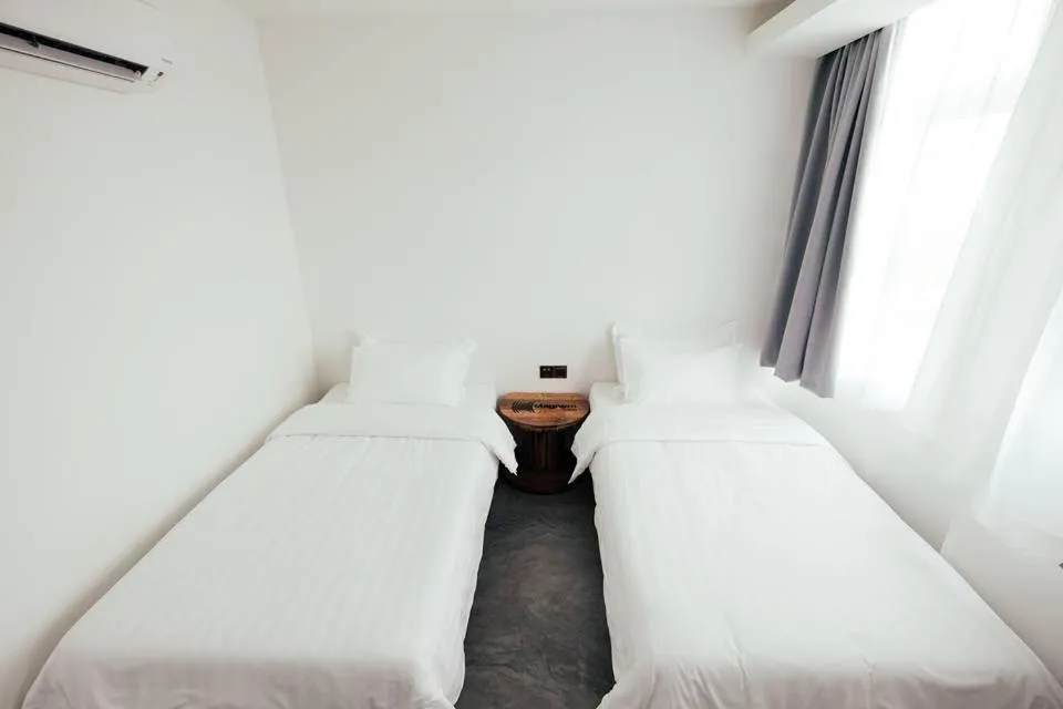 Bed in White Loft Hotel