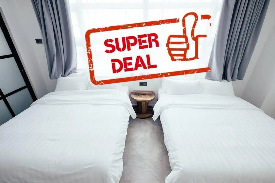 Bed in White Loft Hotel