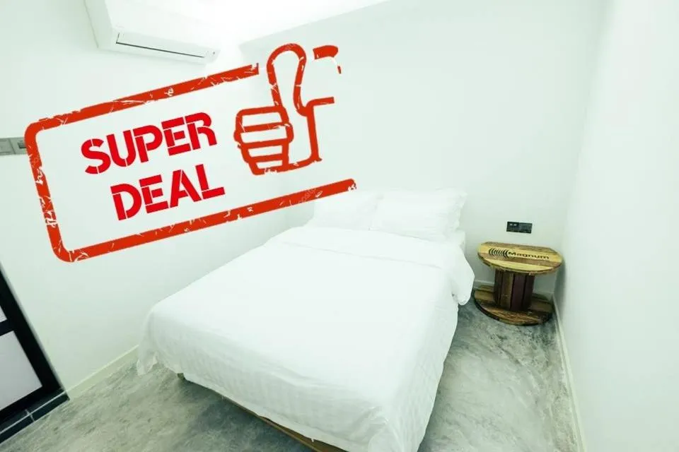 Bed in White Loft Hotel