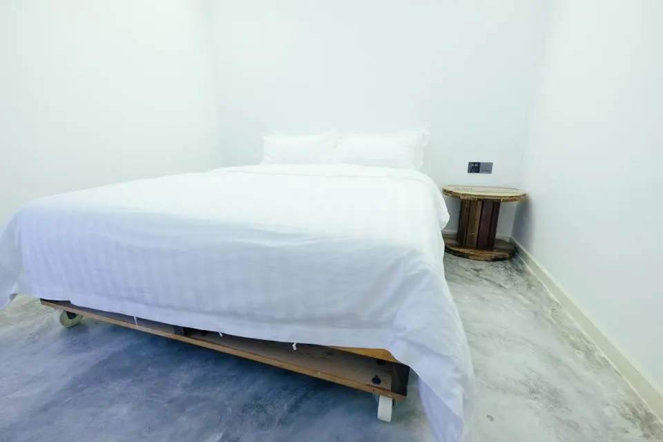 Bed in White Loft Hotel