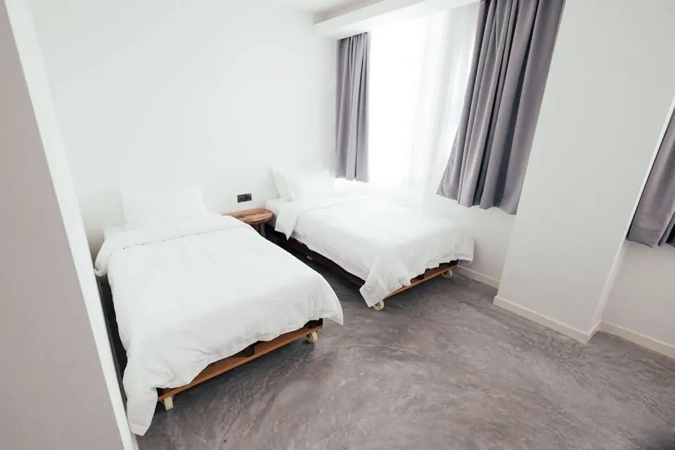 Bed in White Loft Hotel