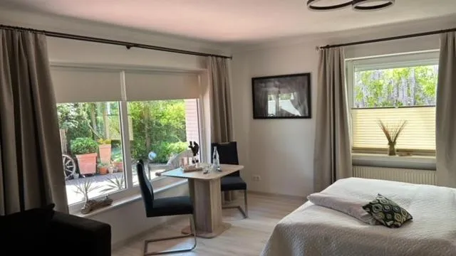 Living room, Bed in Garni Hotel & Appartements Nordstrand