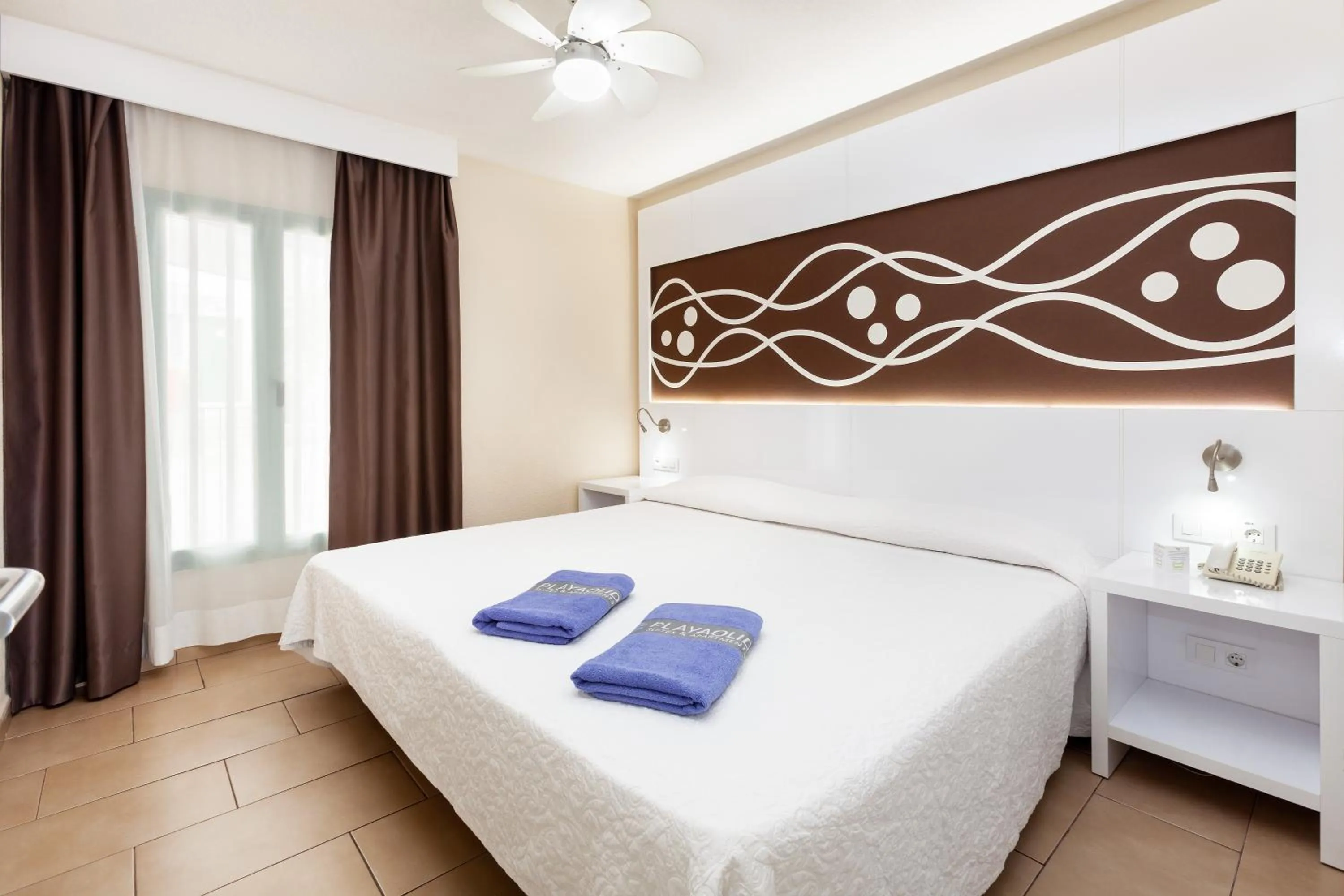 Bed in Playaolid Suites & Apartments