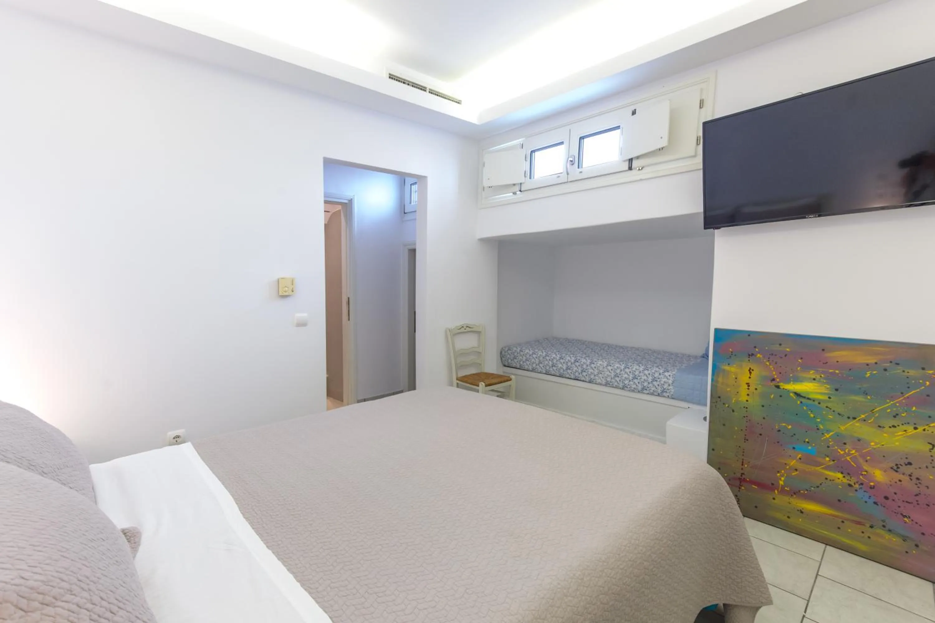 Bed in Alexandros Apartments