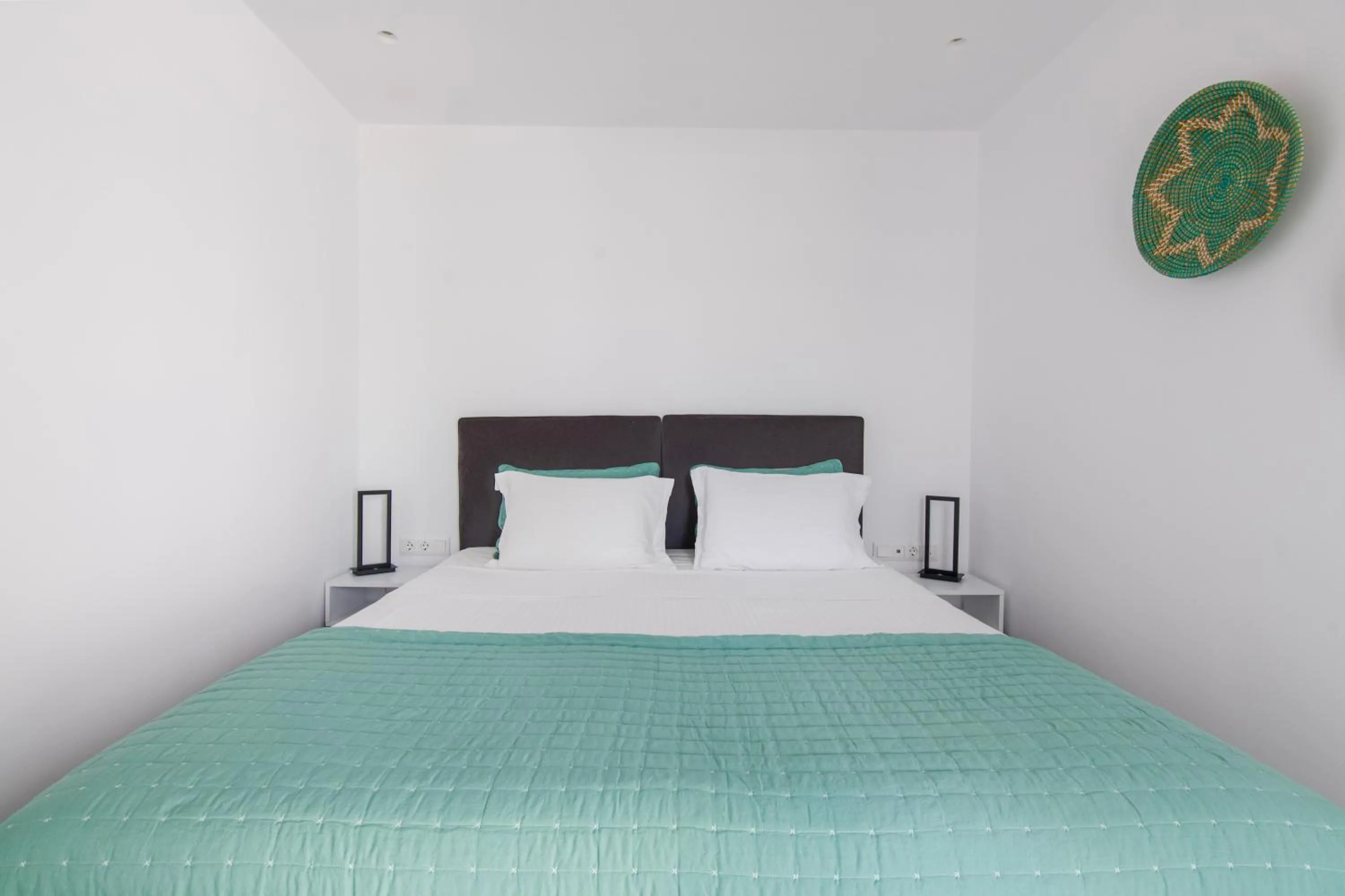 Bed in Alexandros Apartments