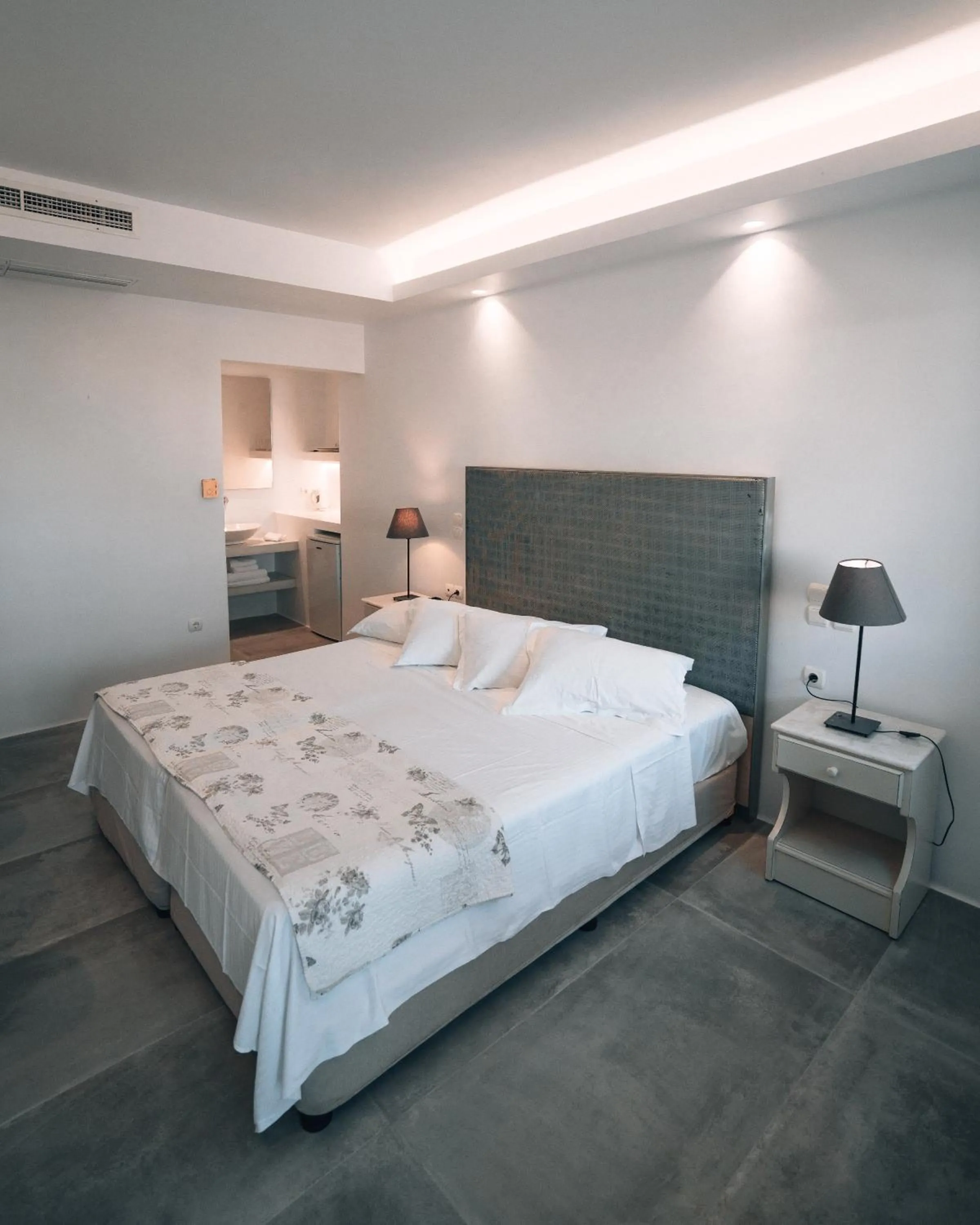 Bed in Alexandros Apartments