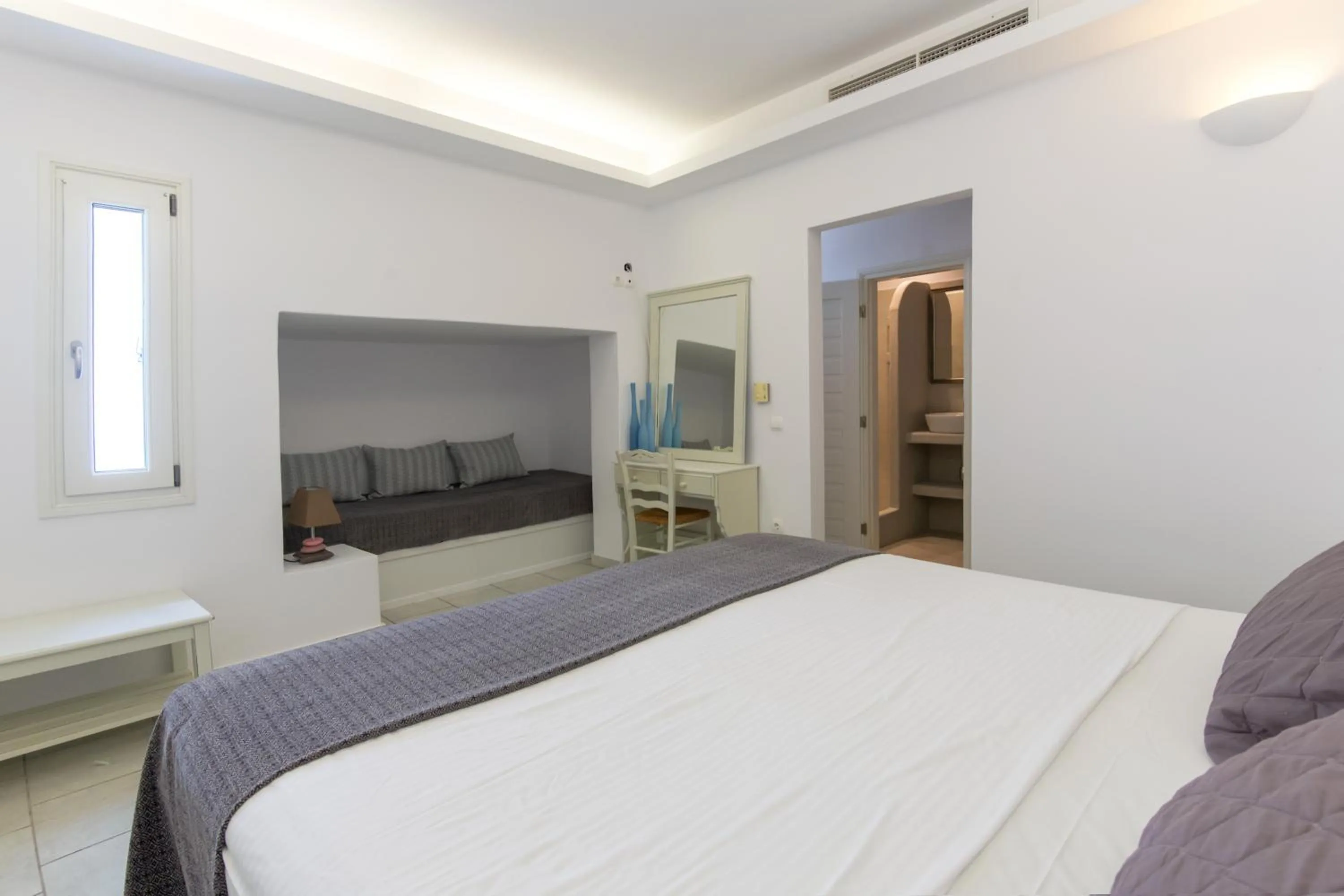Bed in Alexandros Apartments