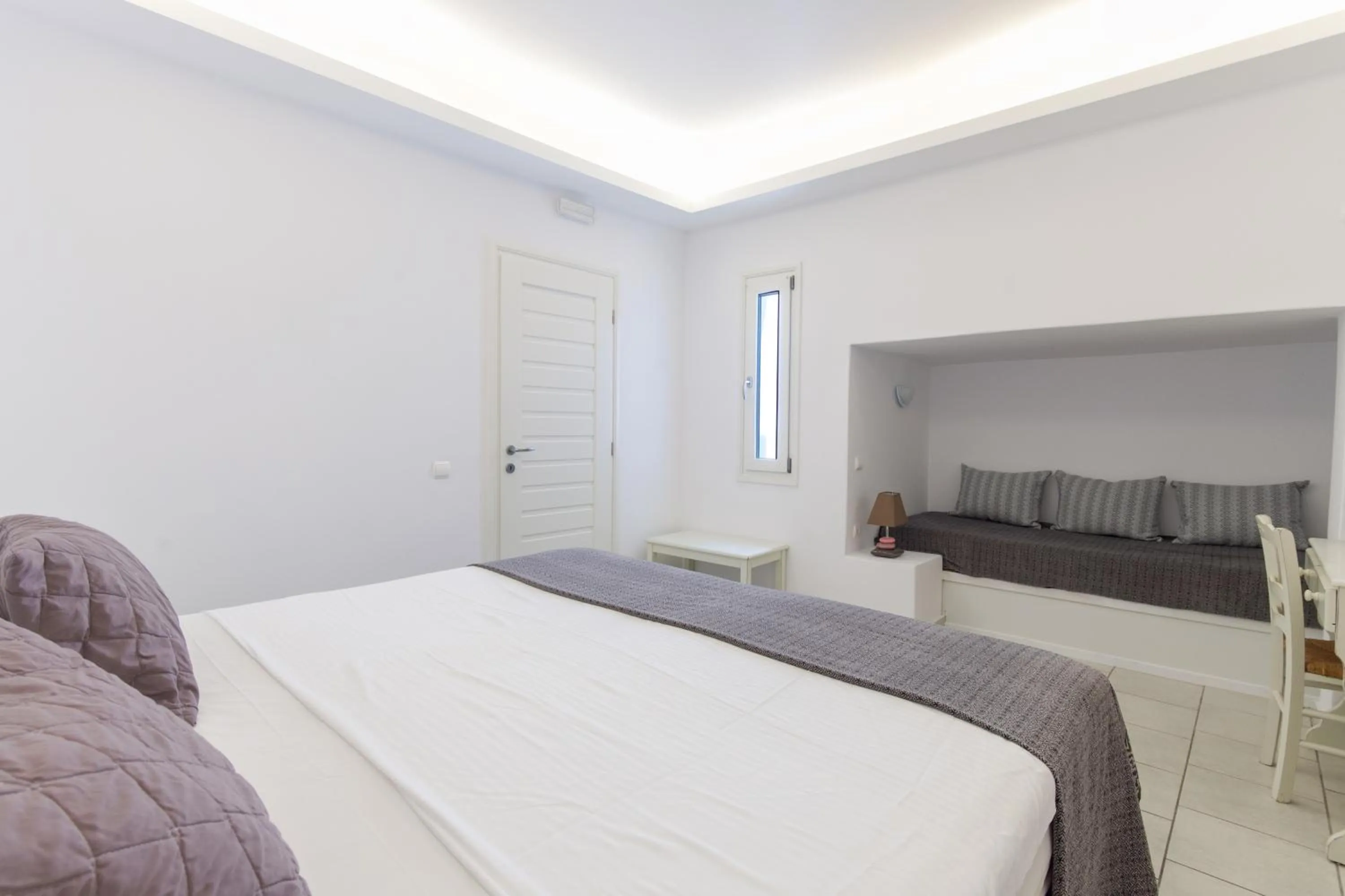 Bed in Alexandros Apartments