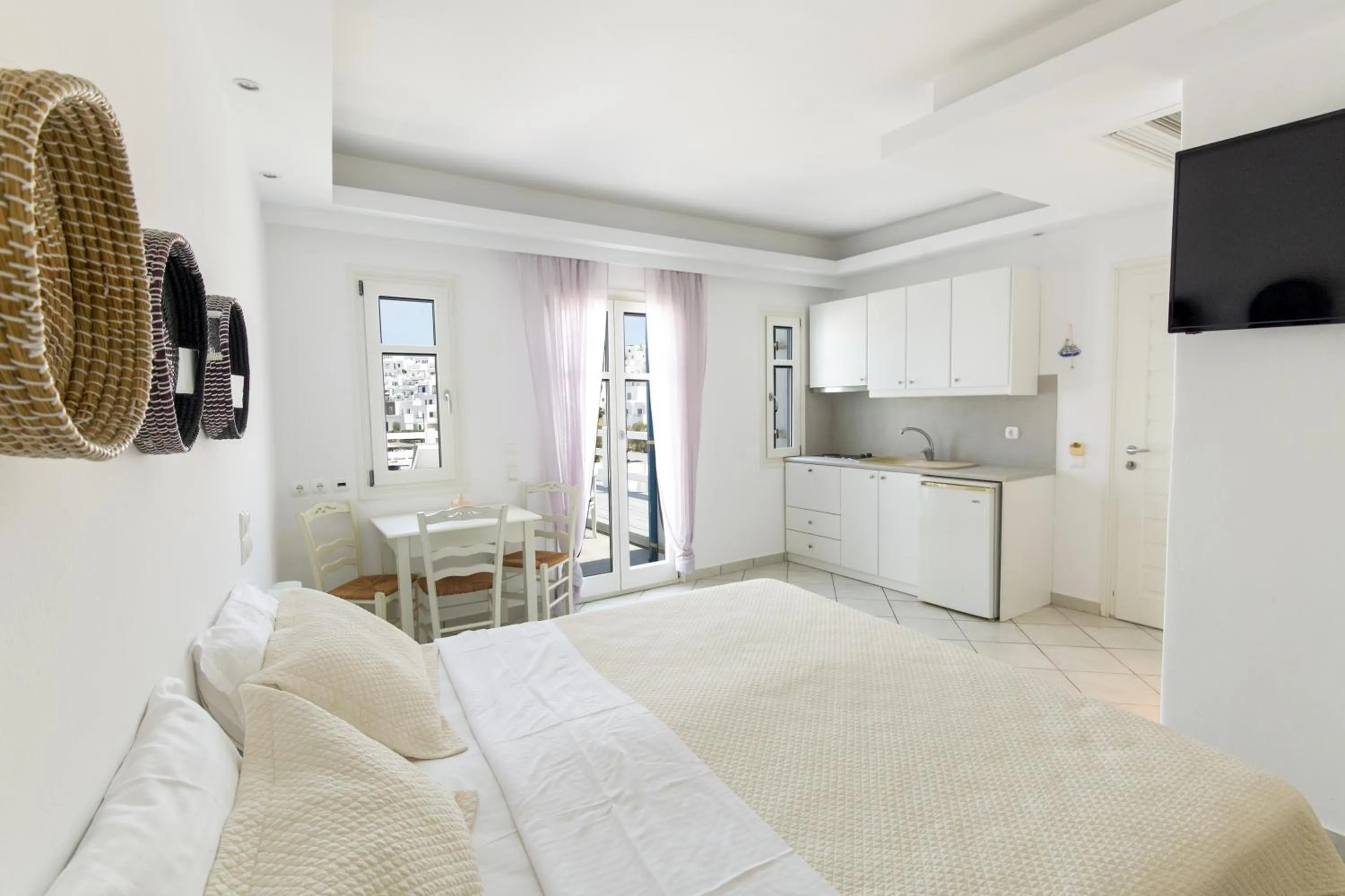 Bed in Alexandros Apartments