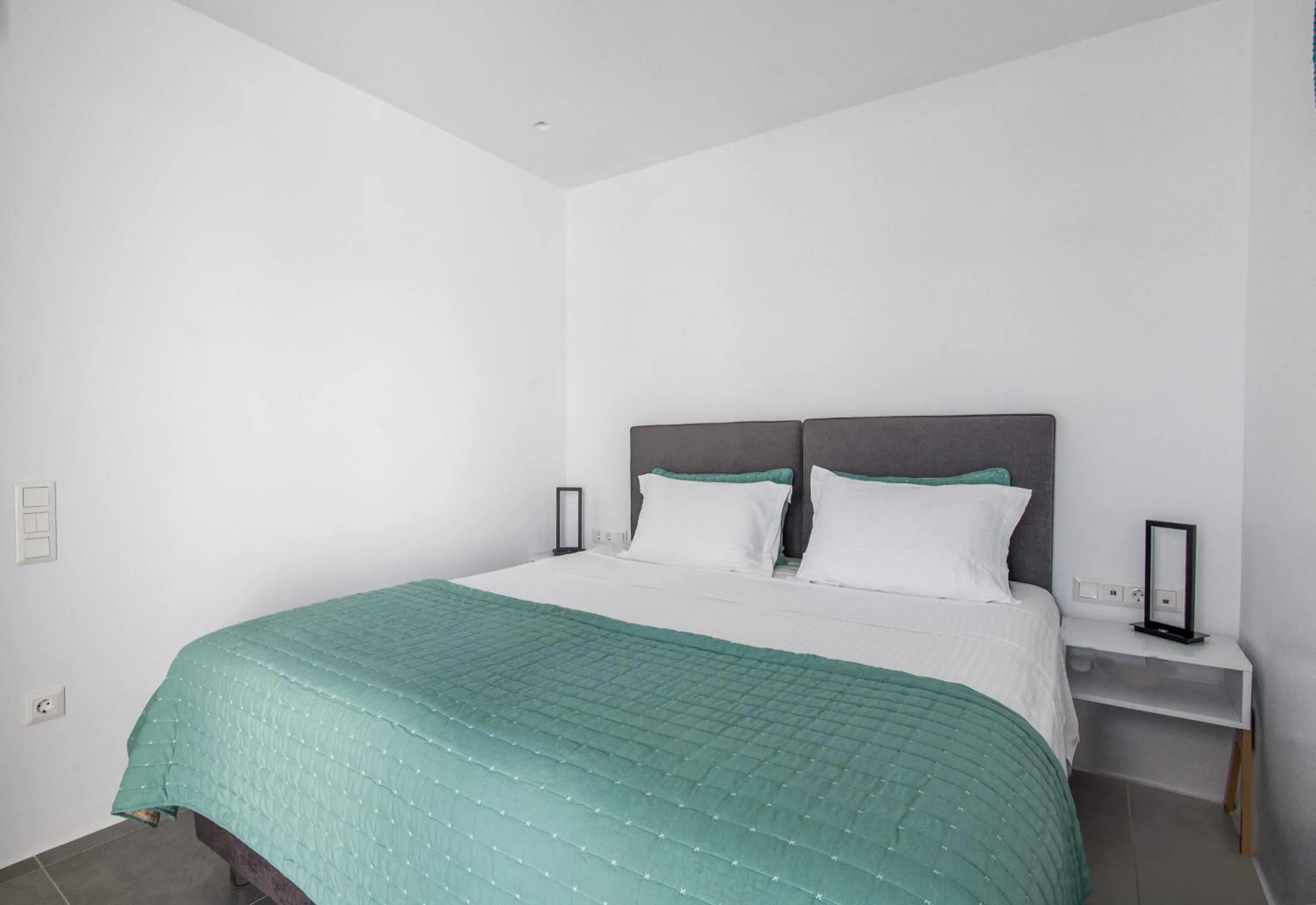 Bed in Alexandros Apartments