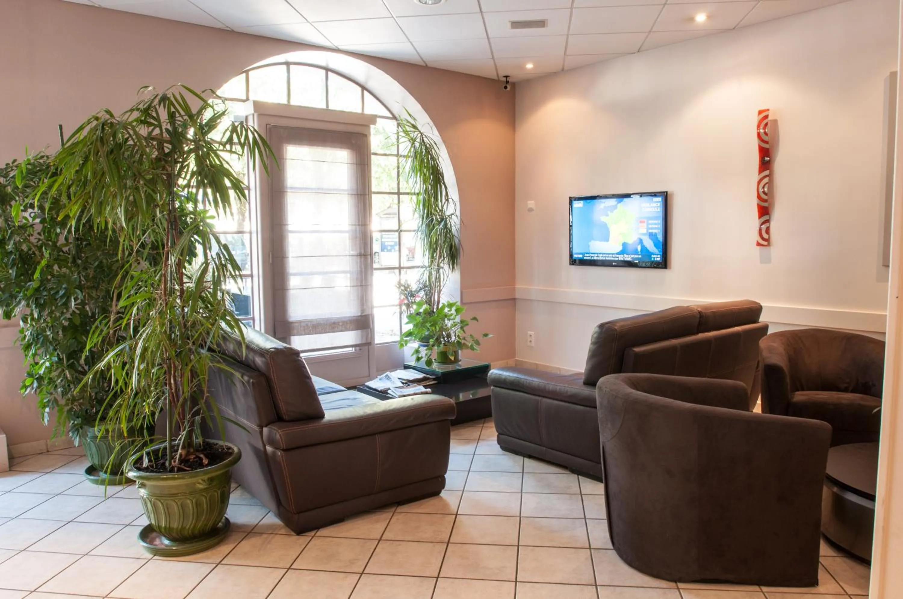 Property building in Logis Hotel du Parc-Restaurant - Le Rouget de Lisle