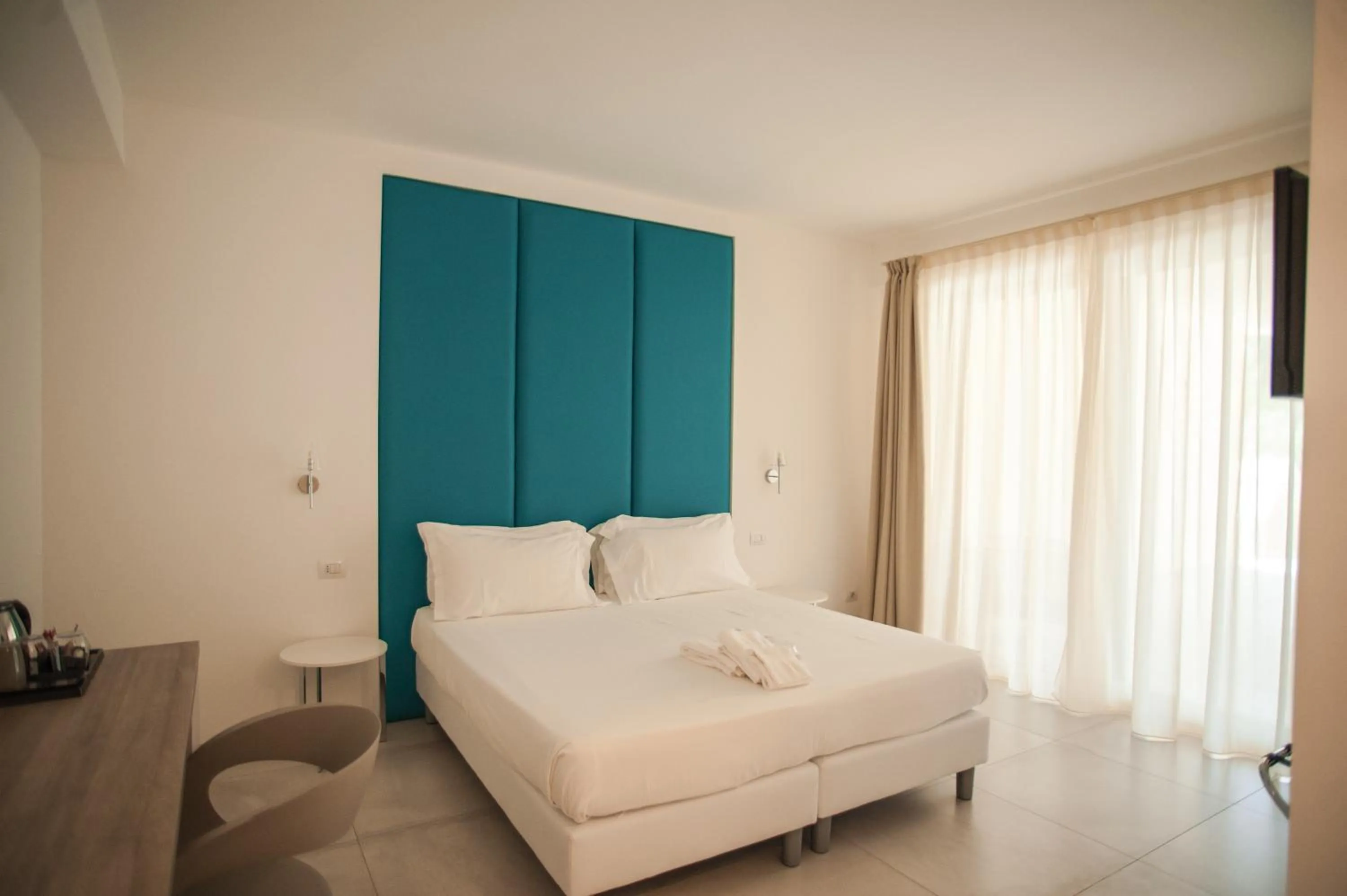 Bed in Luna Minoica Suites and Apartments