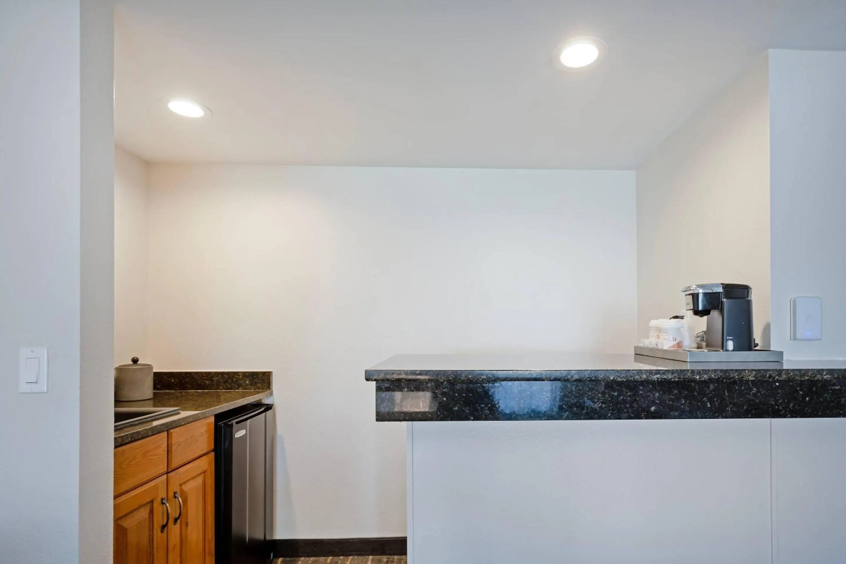 Bedroom in The Lux Hotel & Conference Center, an Ascend Collection Hotel