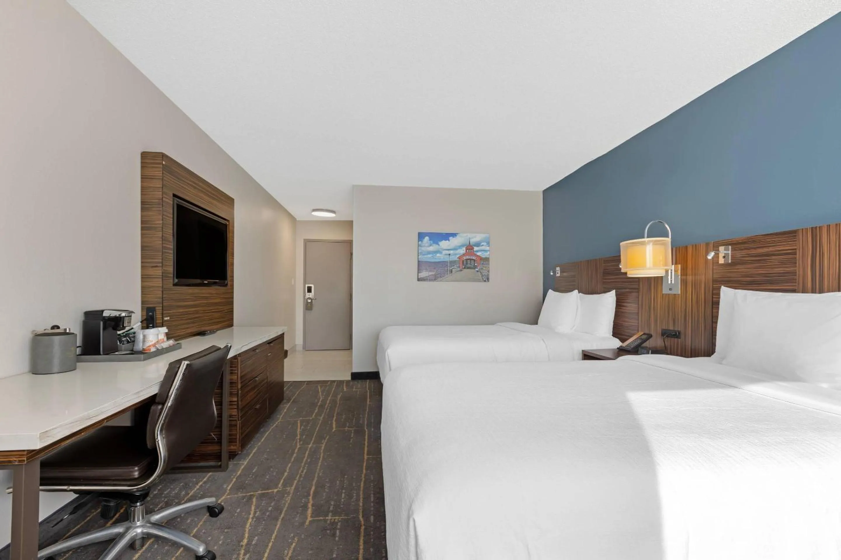 Bedroom, Bed in The Lux Hotel & Conference Center, an Ascend Collection Hotel