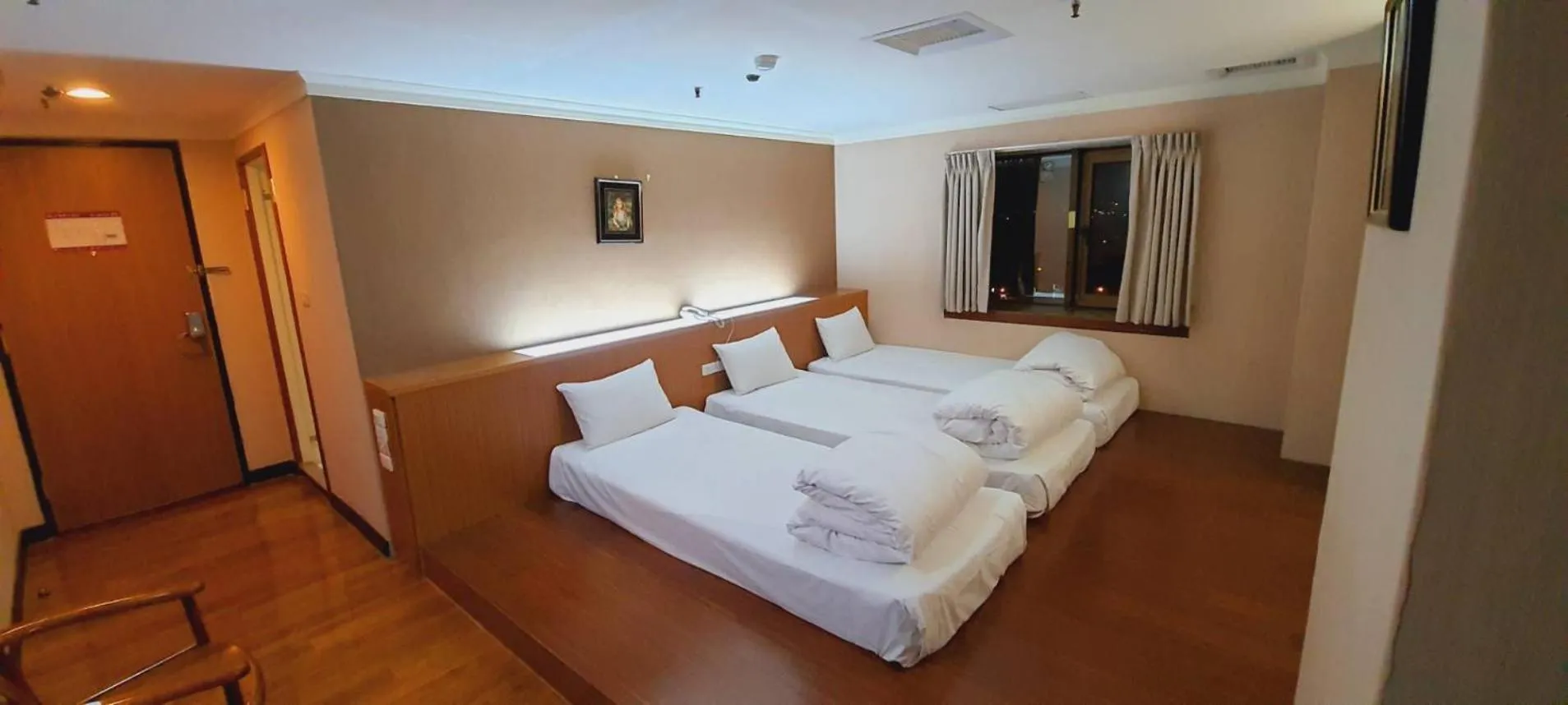 Bed in Tapeng Bay Holiday Hotel