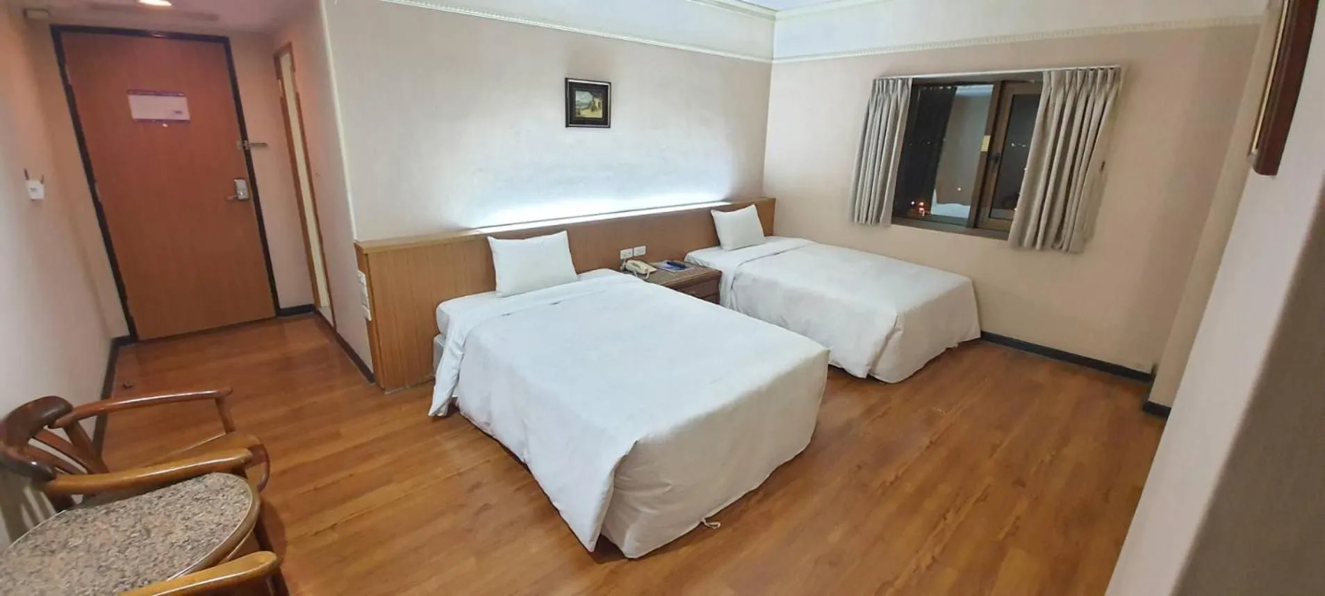 Bed in Tapeng Bay Holiday Hotel