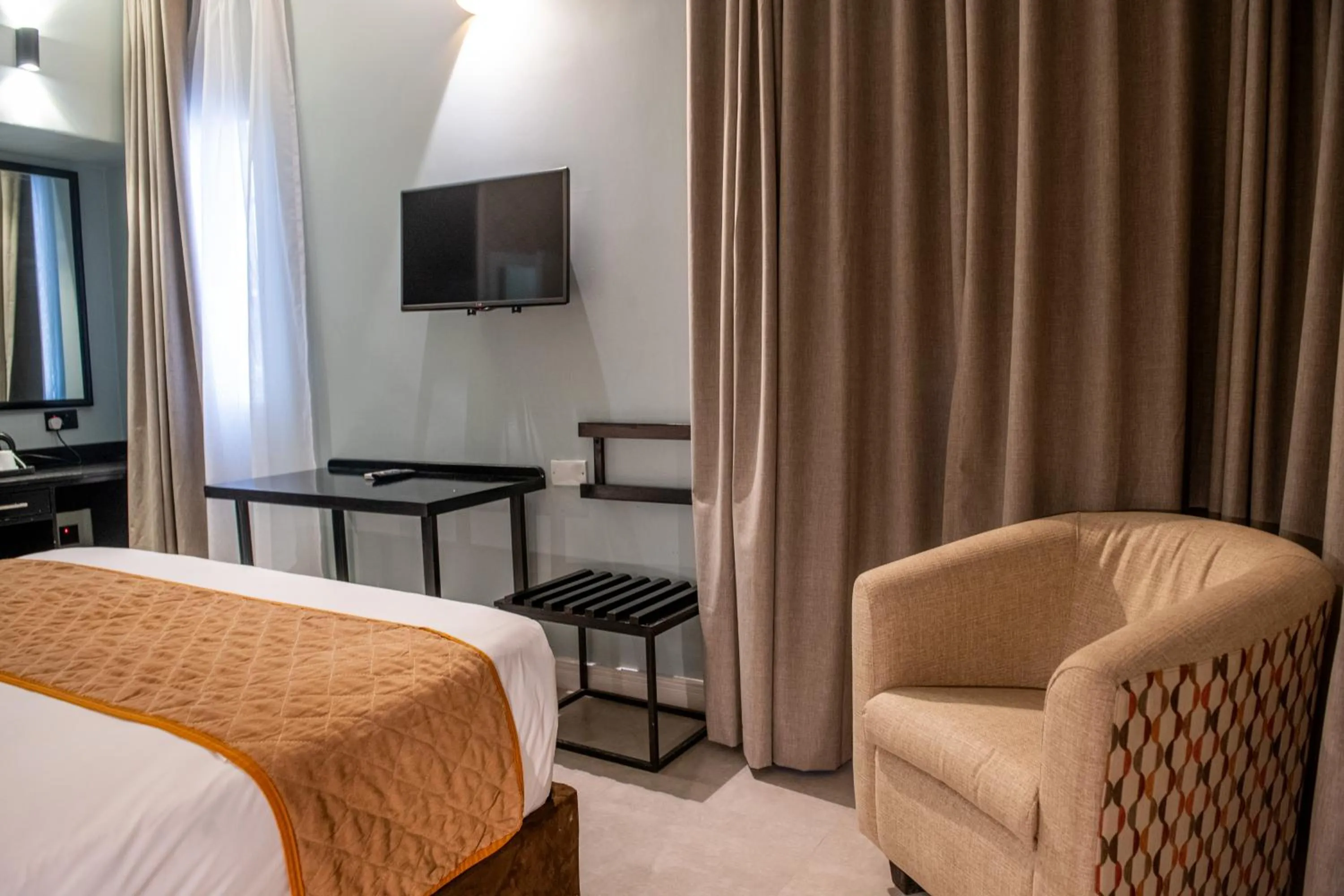 Bed in New Ambassador Hotel