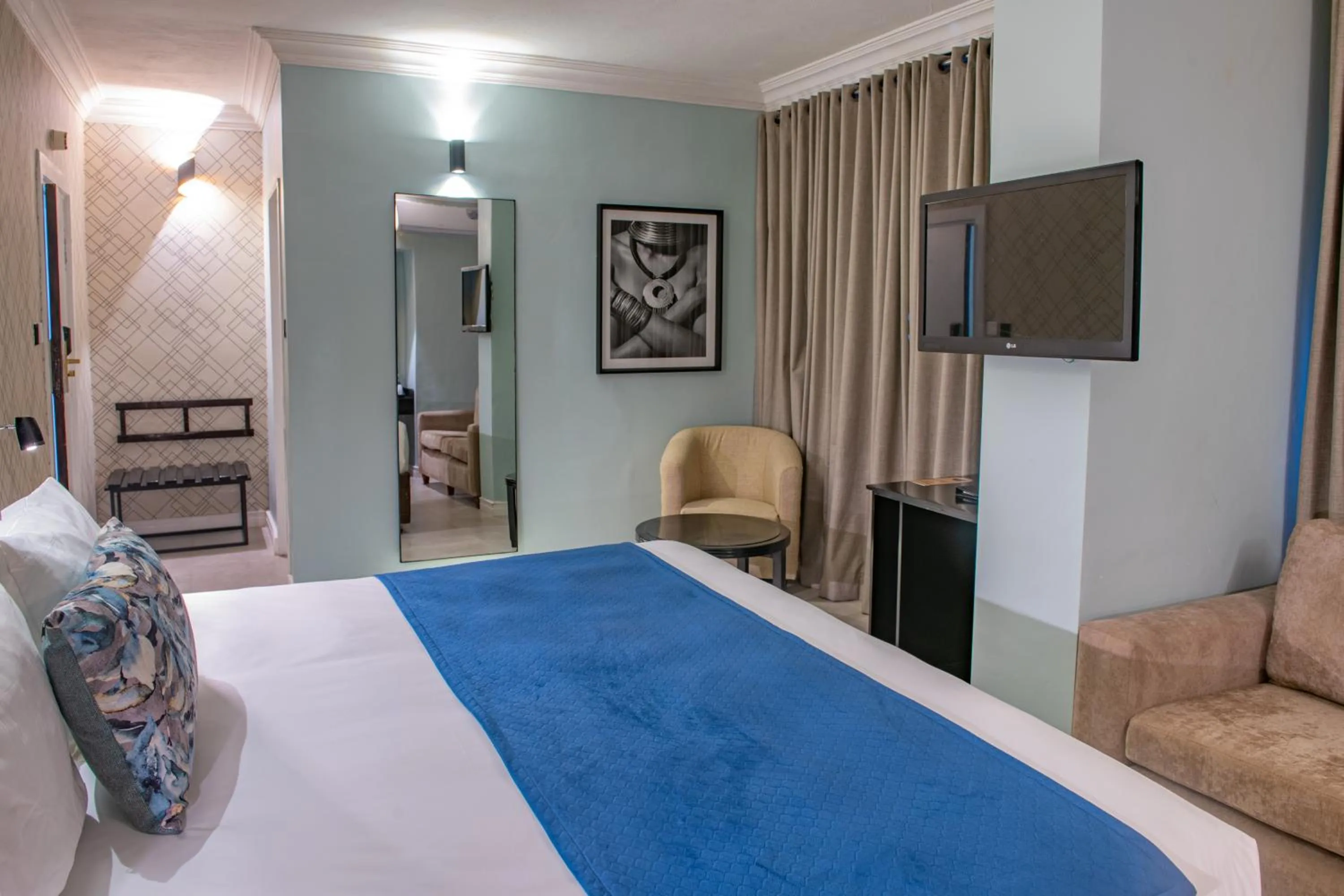 Bed in New Ambassador Hotel