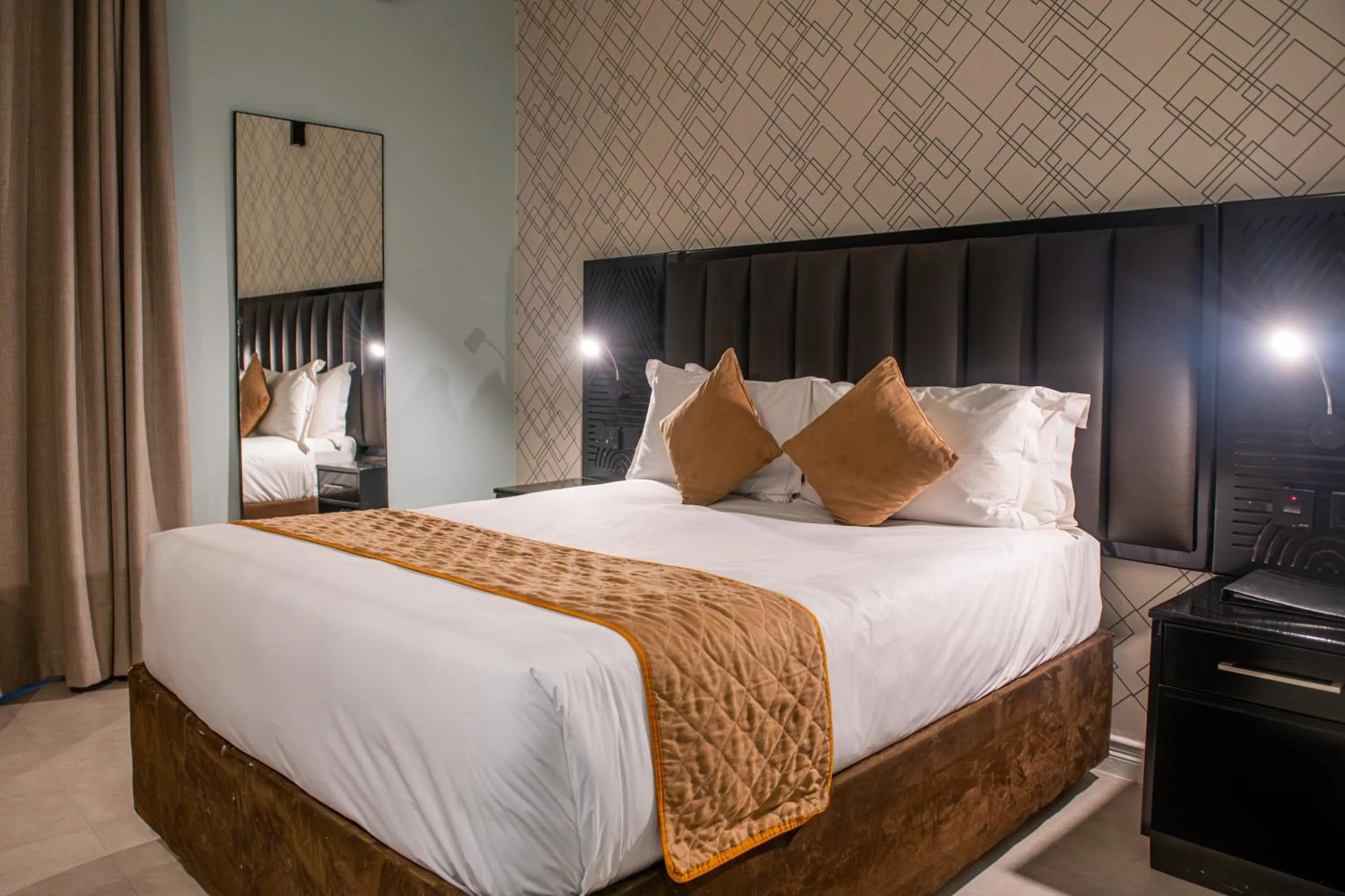 Bed in New Ambassador Hotel